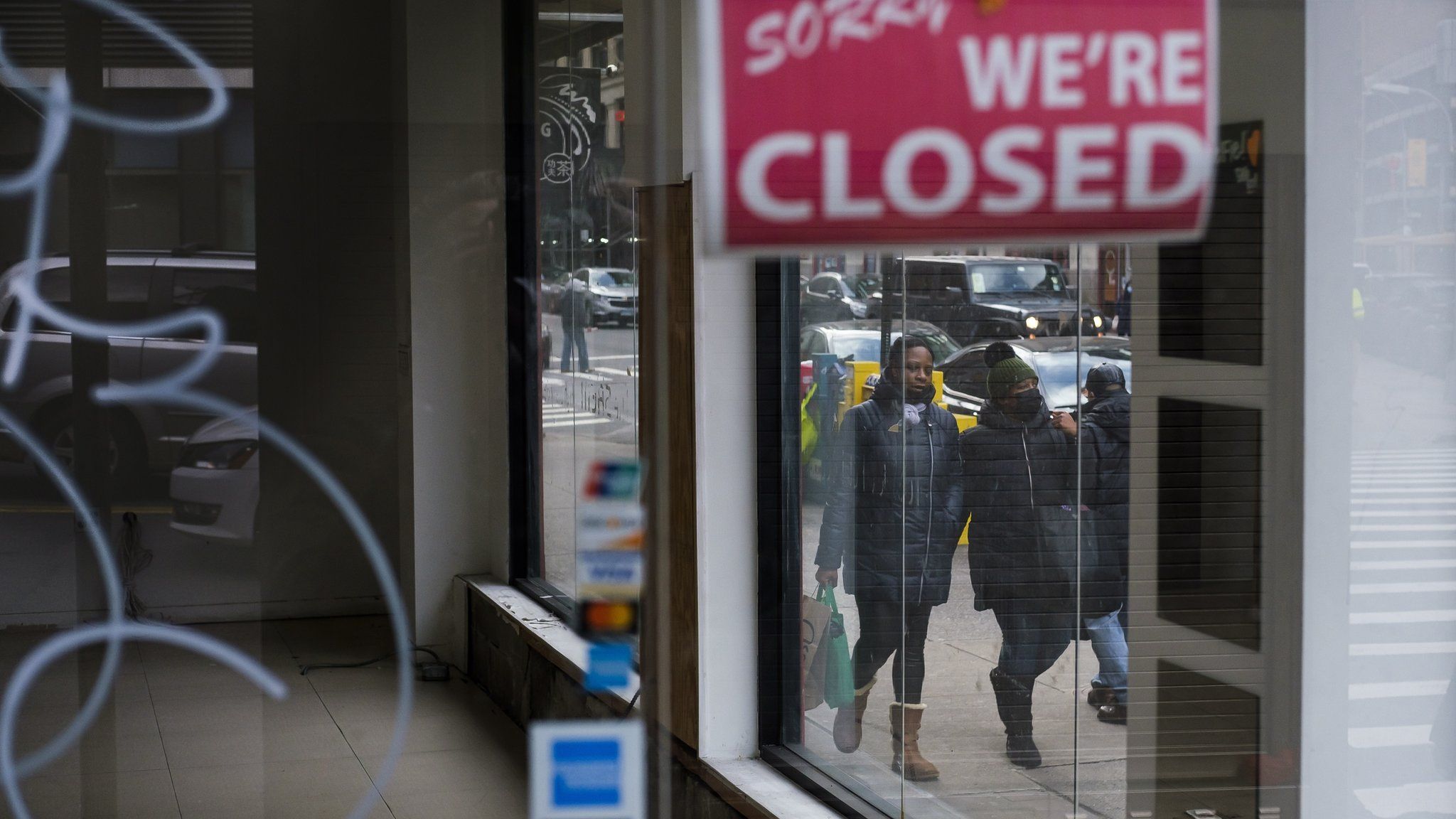 Pedestrians walk past a closed store in New York, New York, USA, on 08 January 2021. The United Statesâ€™ Bureau of Labor Statistics released data today showing that the US economy lost 140,000 jobs in December and that the unemployment rate is at 6.7 percent as businesses continue to struggle with the economic impact of the coronavirus pandemic
