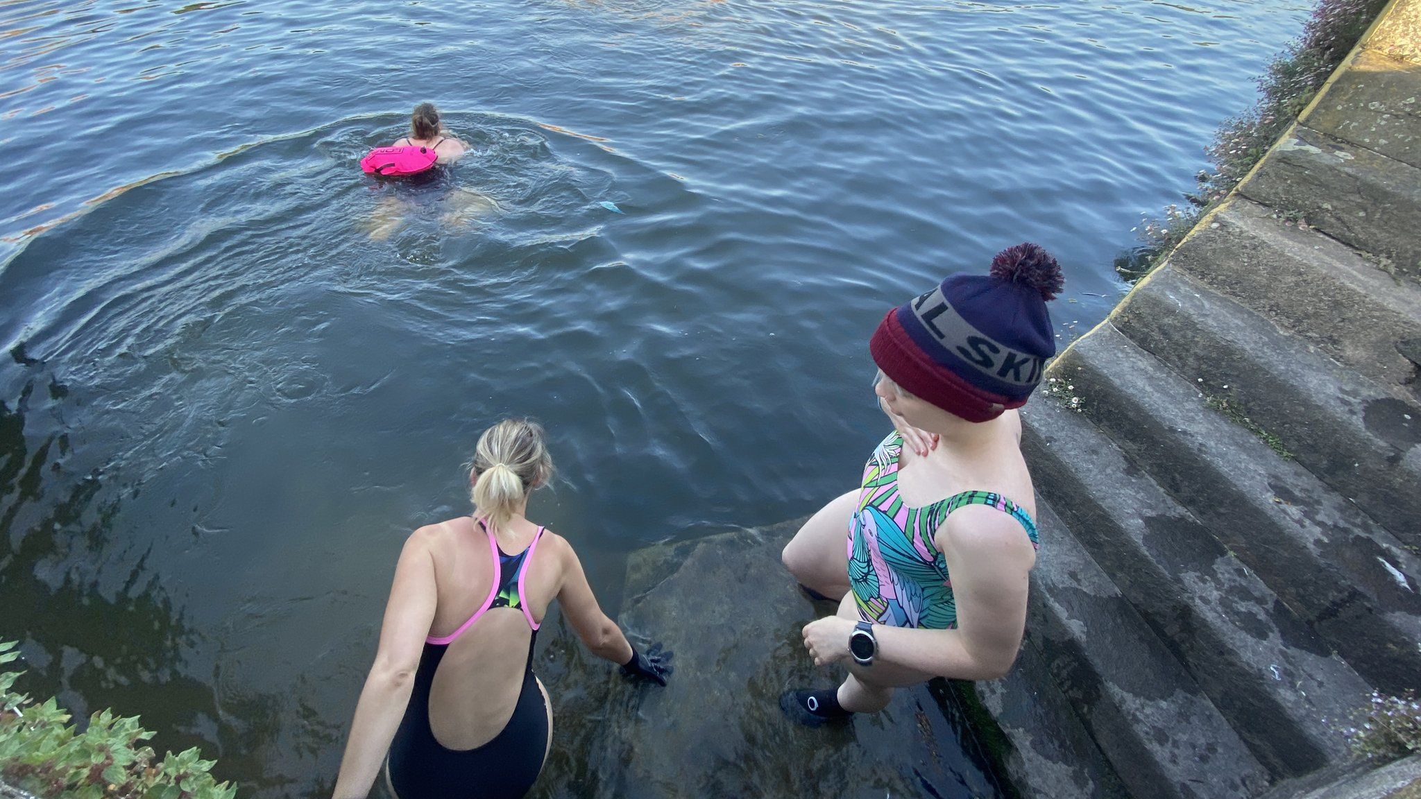 Swimmers entering water