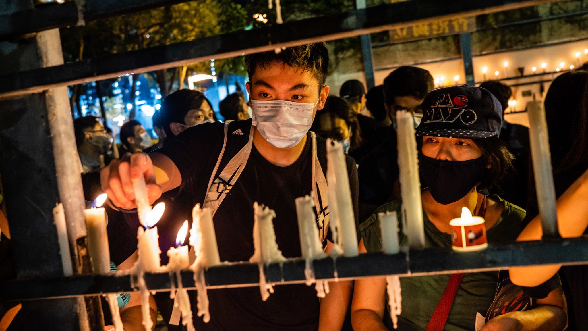 Protesters light candles during the 31st anniversary of the Tiananmen Massacre. Thousands gathered for the annual memorial vigil in Victoria Park to mark the 1989 Tiananmen Square Massacre despite a police ban citing coronavirus social distancing restrictions.