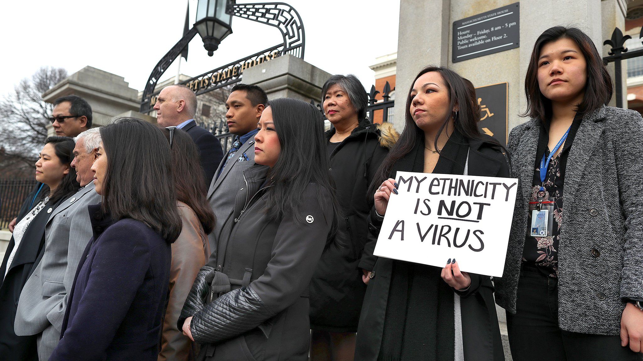 Members of the Asian American Commission hold a press conference on the steps of the Massachusetts State House to condemn racism towards the Asian American community because of coronavirus on March 12, 2020 in Boston