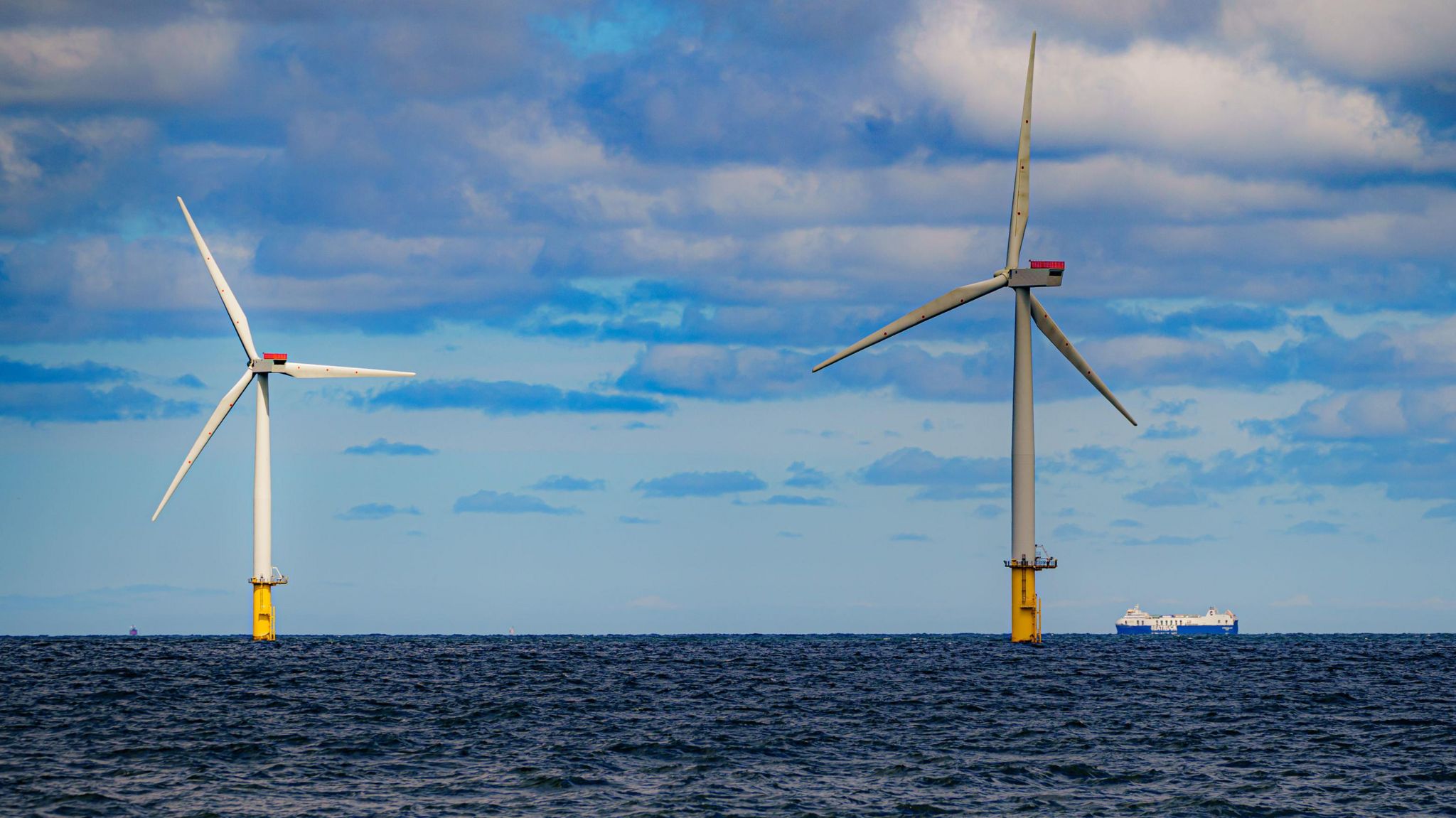 Offshore wind turbines with a ship passing by