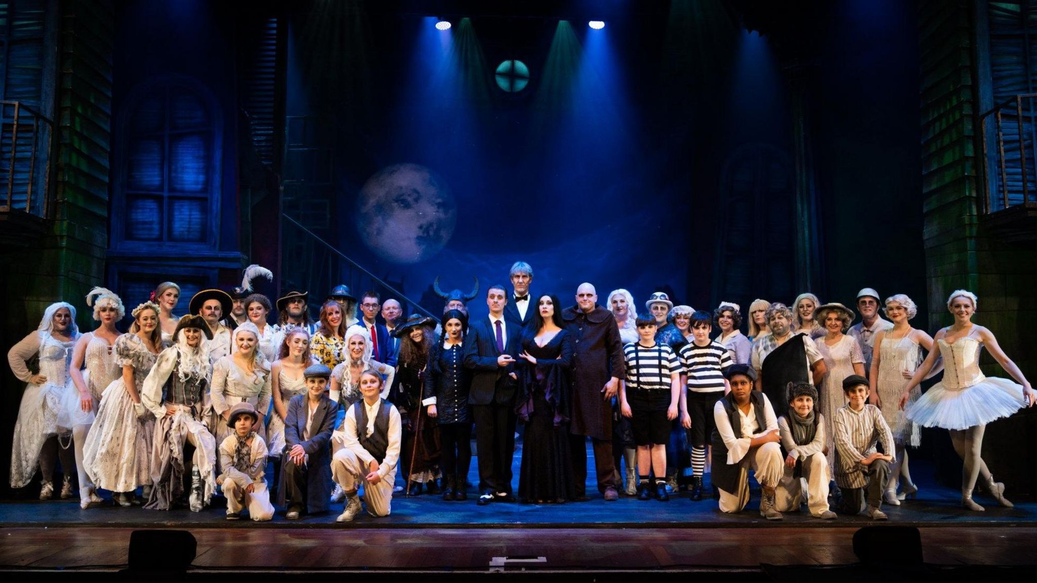 Cast of The Addams Family on stage