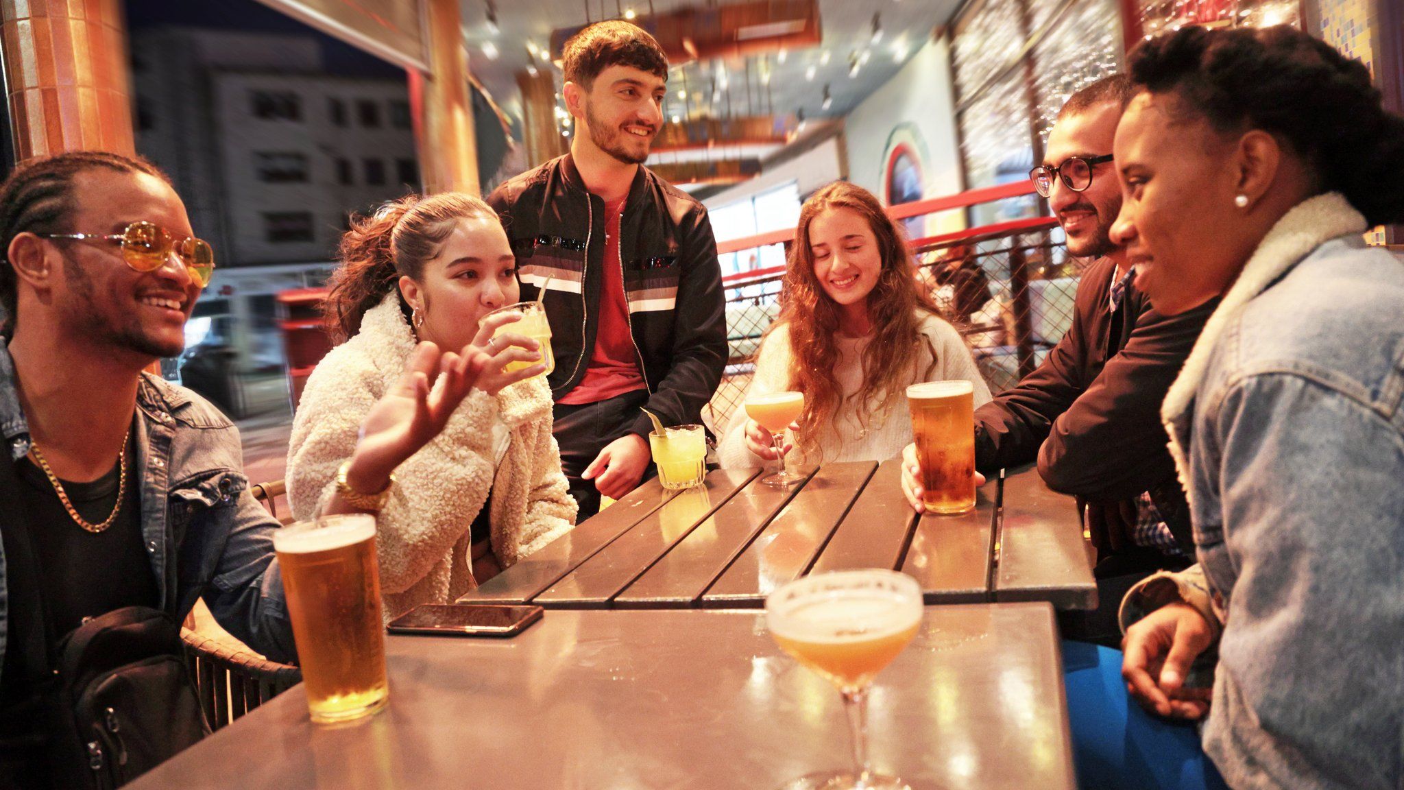 Six people drinking in a beer garden