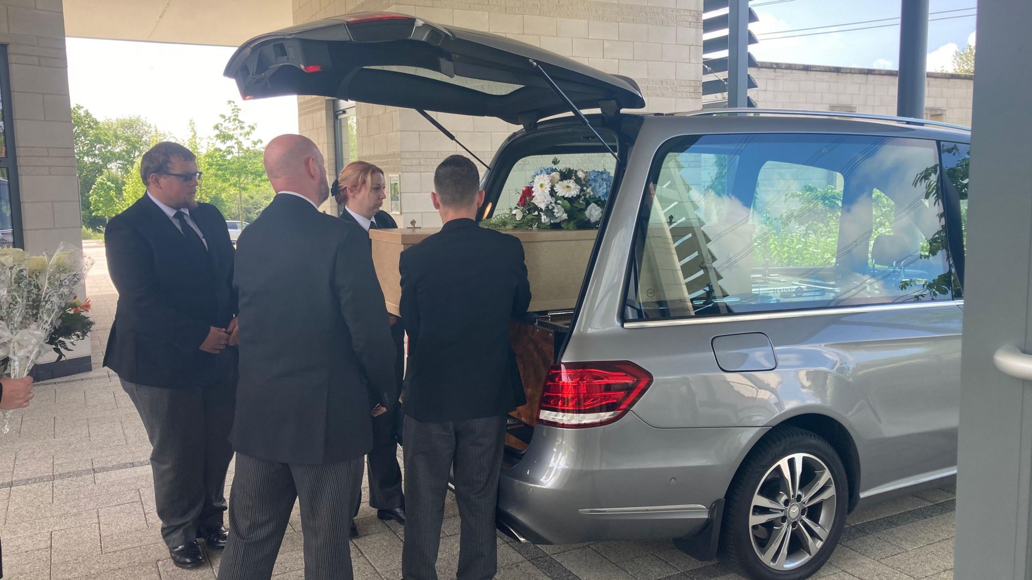 Pallbearers with the coffin at Wealden Crematorium
