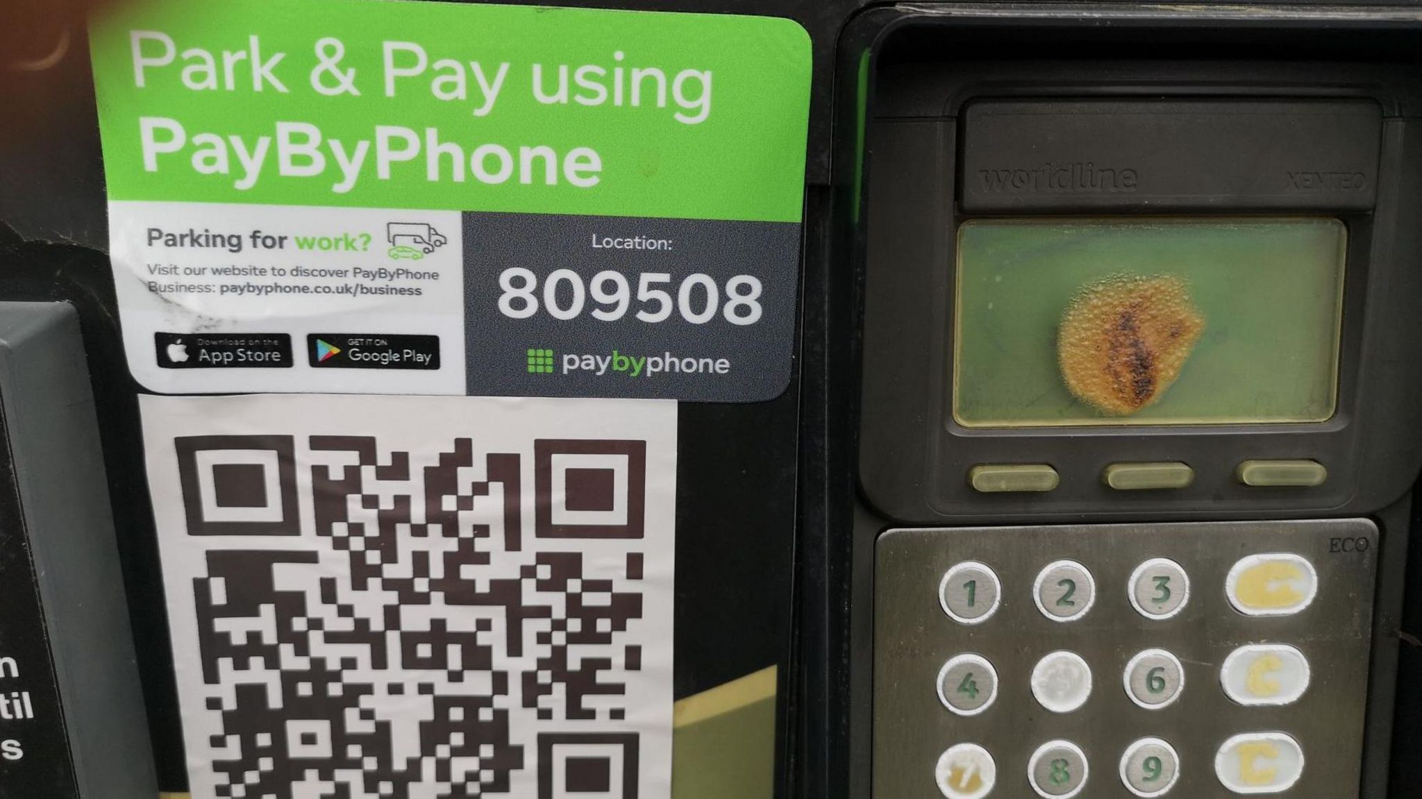 A parking payment machine with the fake QR code on its front