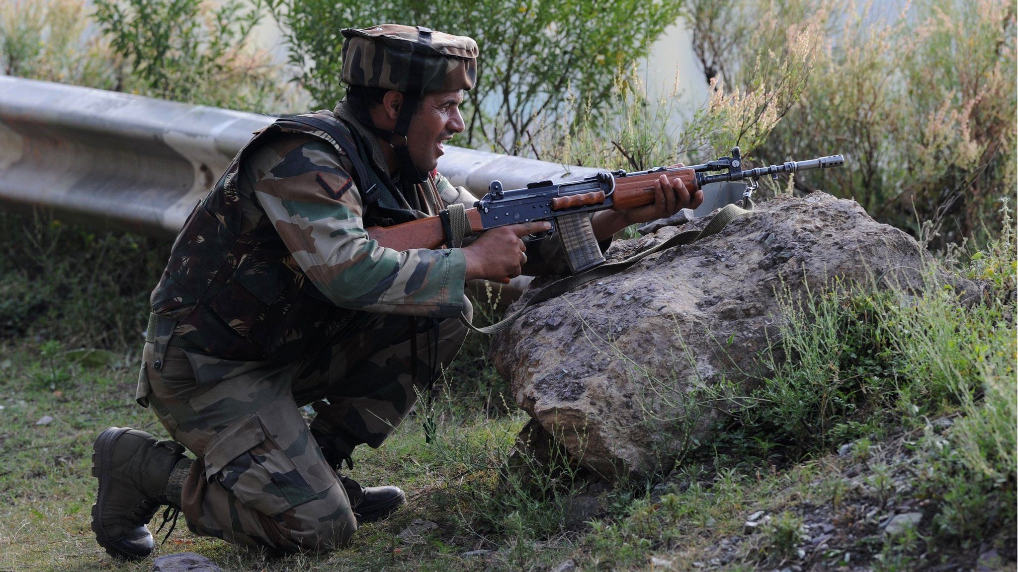 An Indian army soldier takes up a position near the site of the attack. 18 September 2016.