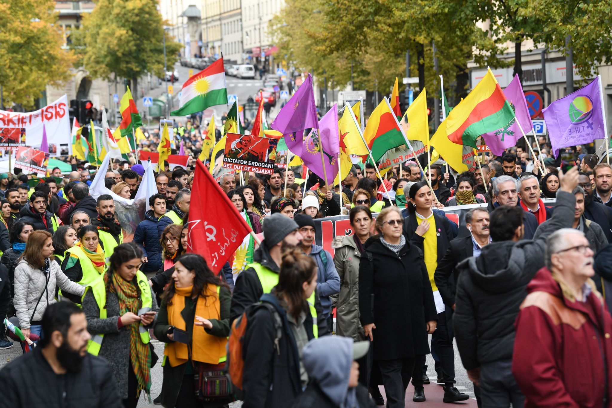Kurdish protesters take part in a demonstration holding Kurdish flags in Stockholm, Sweden, on October 12, 2019, to support Kurdish militants as Turkey keeps up its assault on Kurdish-held border towns in northeastern Syria