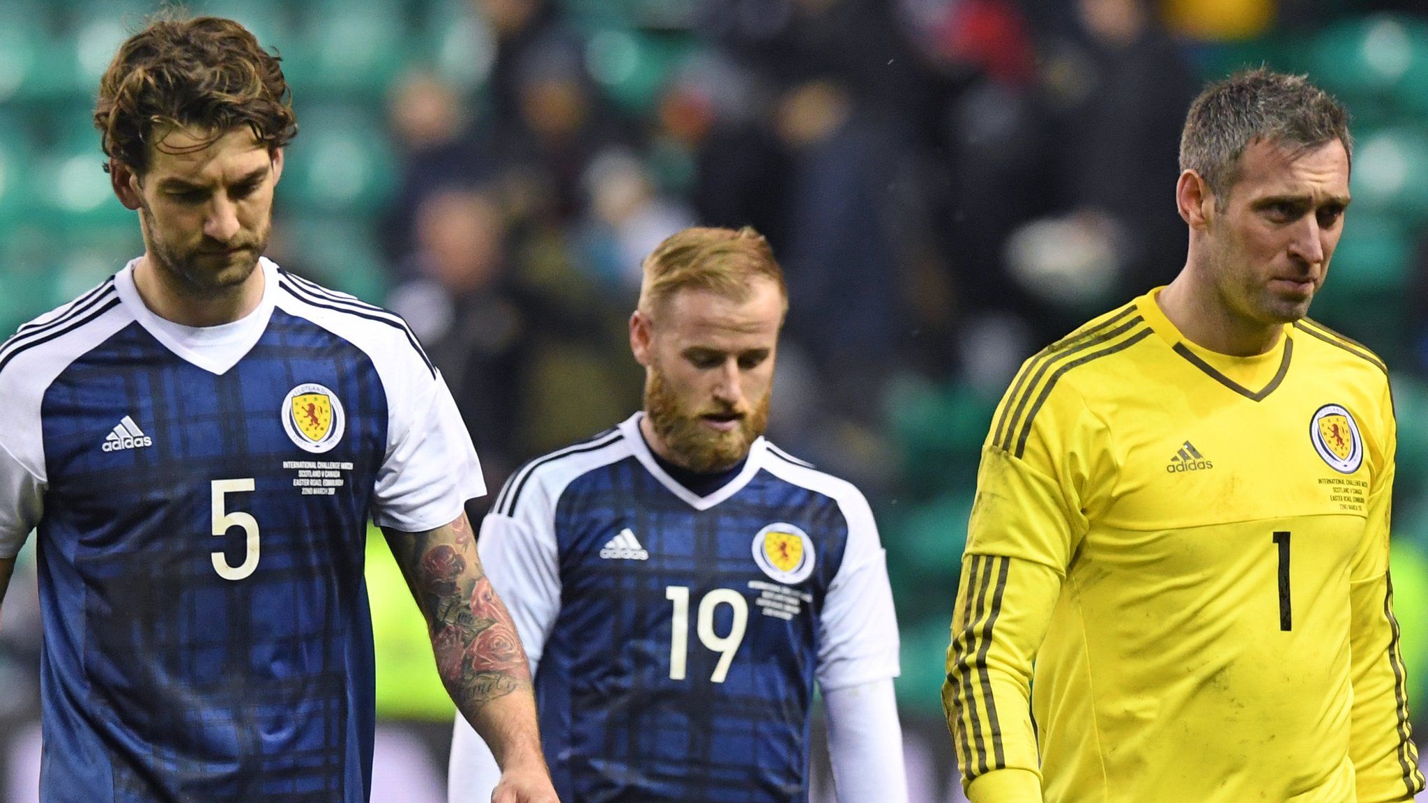 Charlie Mulgrew, Barry Bannan and Allan McGregor are left dejected at full time