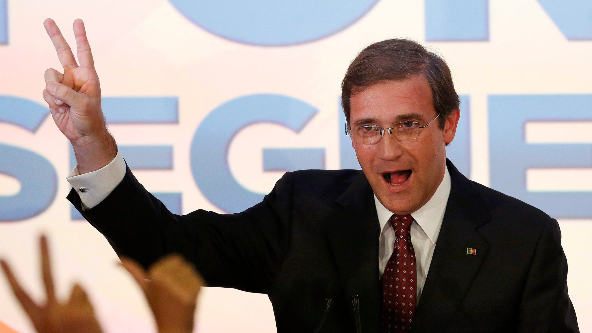 Portugal's Prime Minister Pedro Passos Coelho (left) celebrating after results become clear