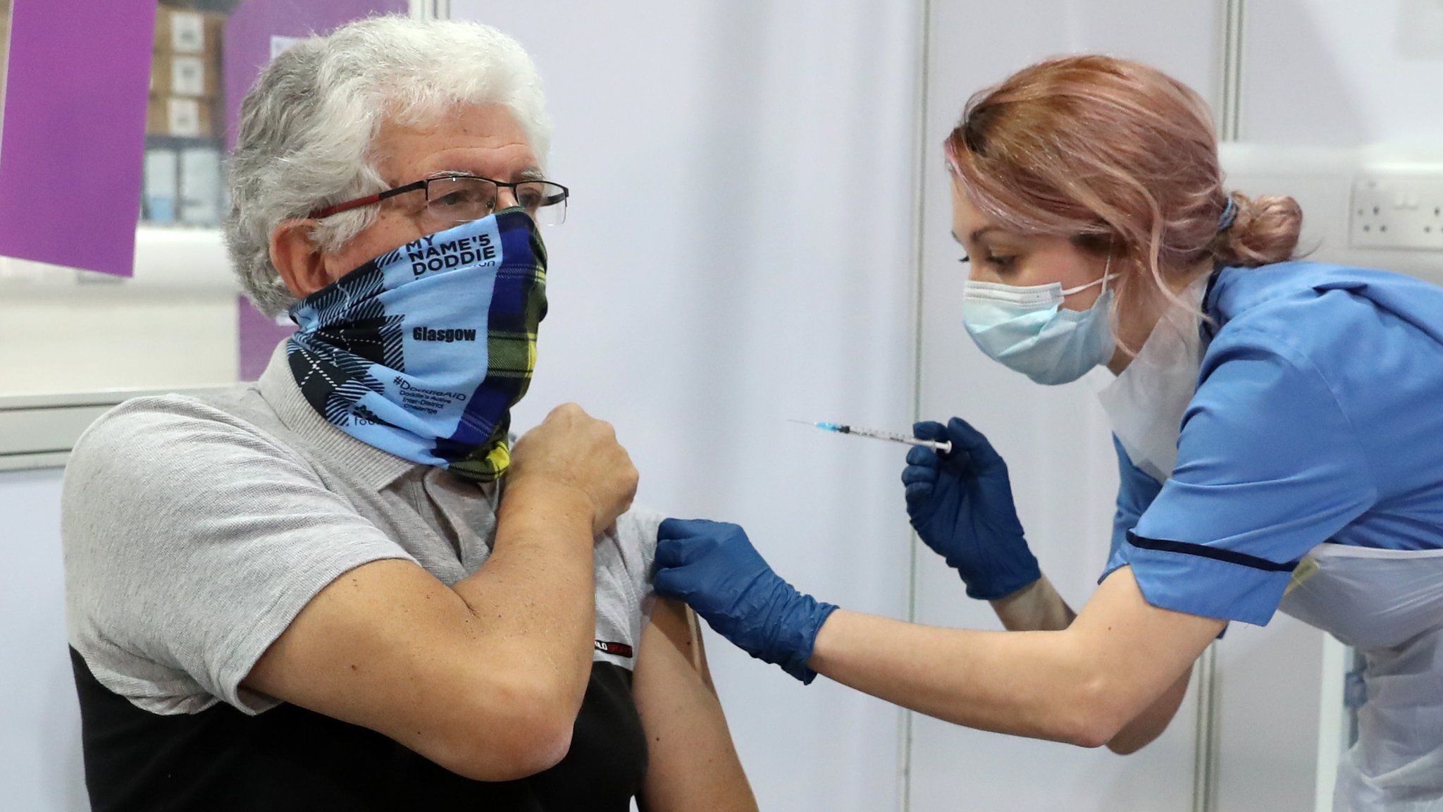 A man receives his Covid-19 vaccination in Glasgow.