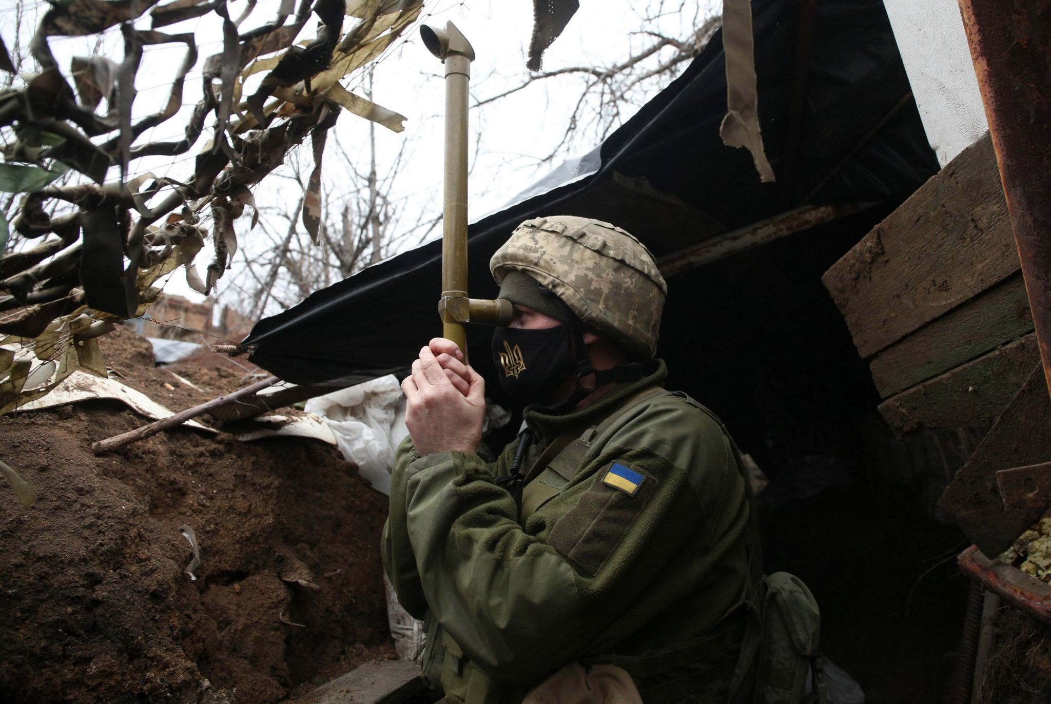 Ukrainian soldier stands guard in the Donetsk region