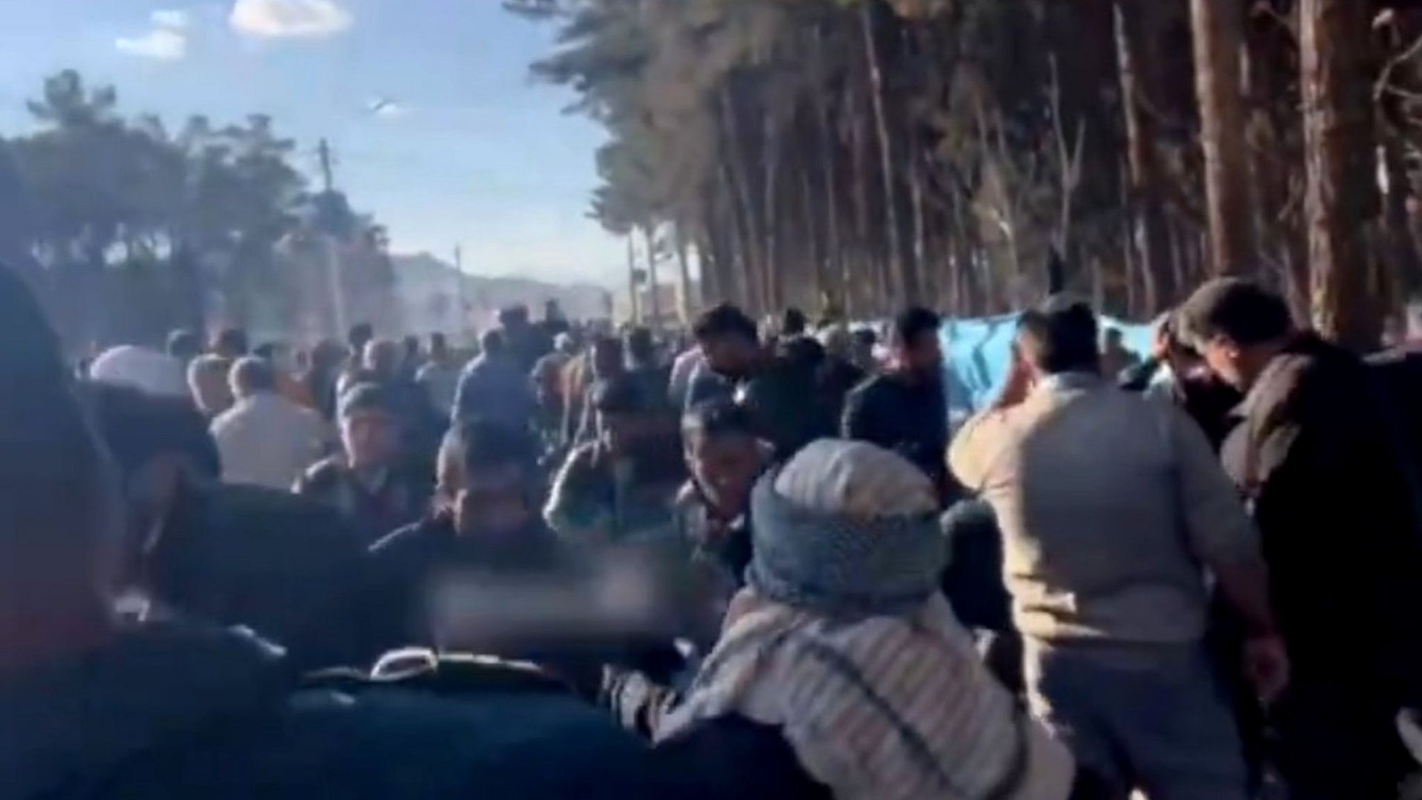 Screengrab of a social media video showing bystanders after two deadly explosions near the Saheb al-Zaman mosque in the southern city of Kerman, Iran (3 January 2023)