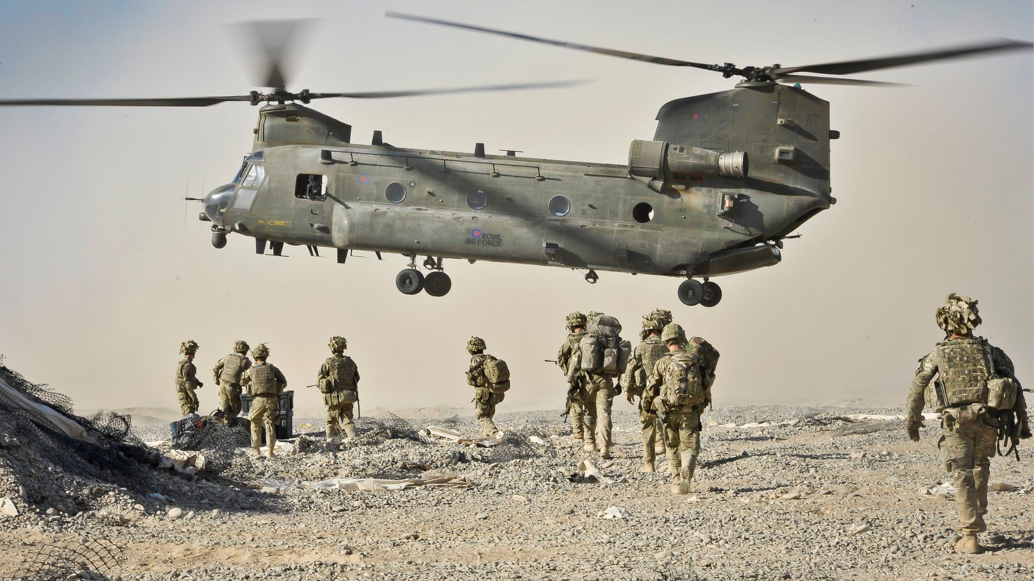 British soldiers approach a Chinook aircraft in the Nahr-e Saraj district, Helmand Province, Afghanistan. Picture date October 2013.