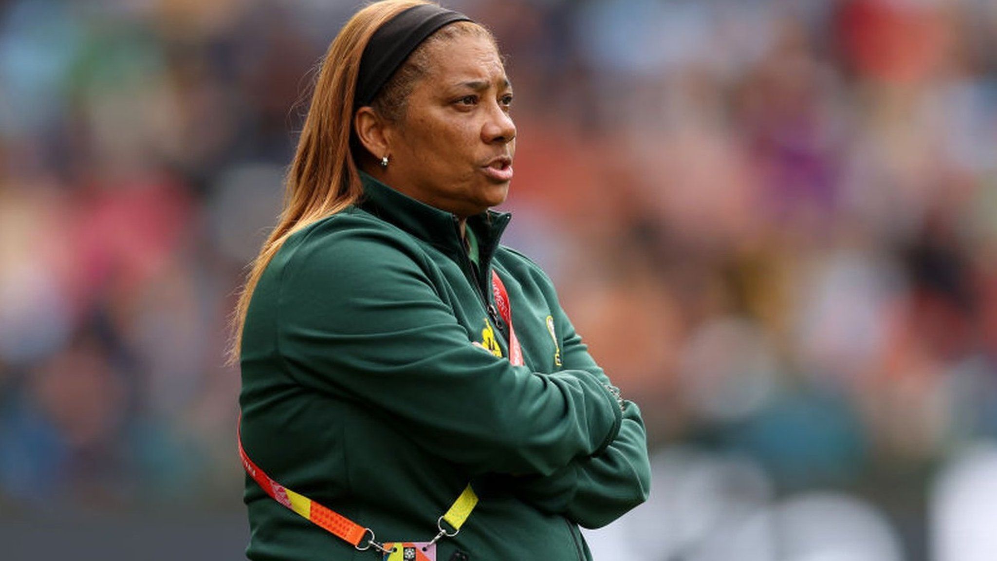 South Africa women's coach Desiree Ellis stands on the sideline during a game