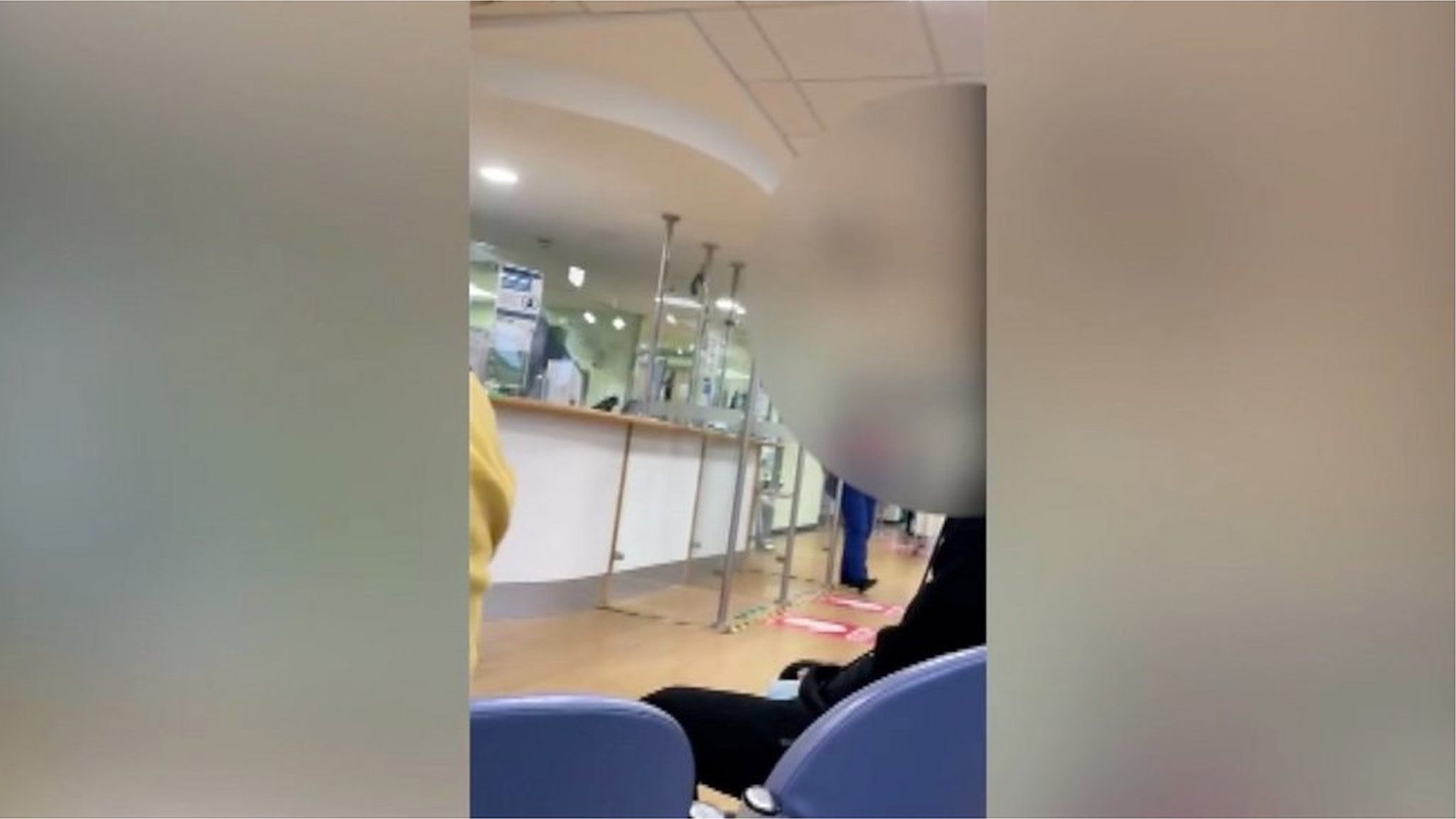 A nurse is filmed as she informs a packed accident and emergency waiting room of long delays.