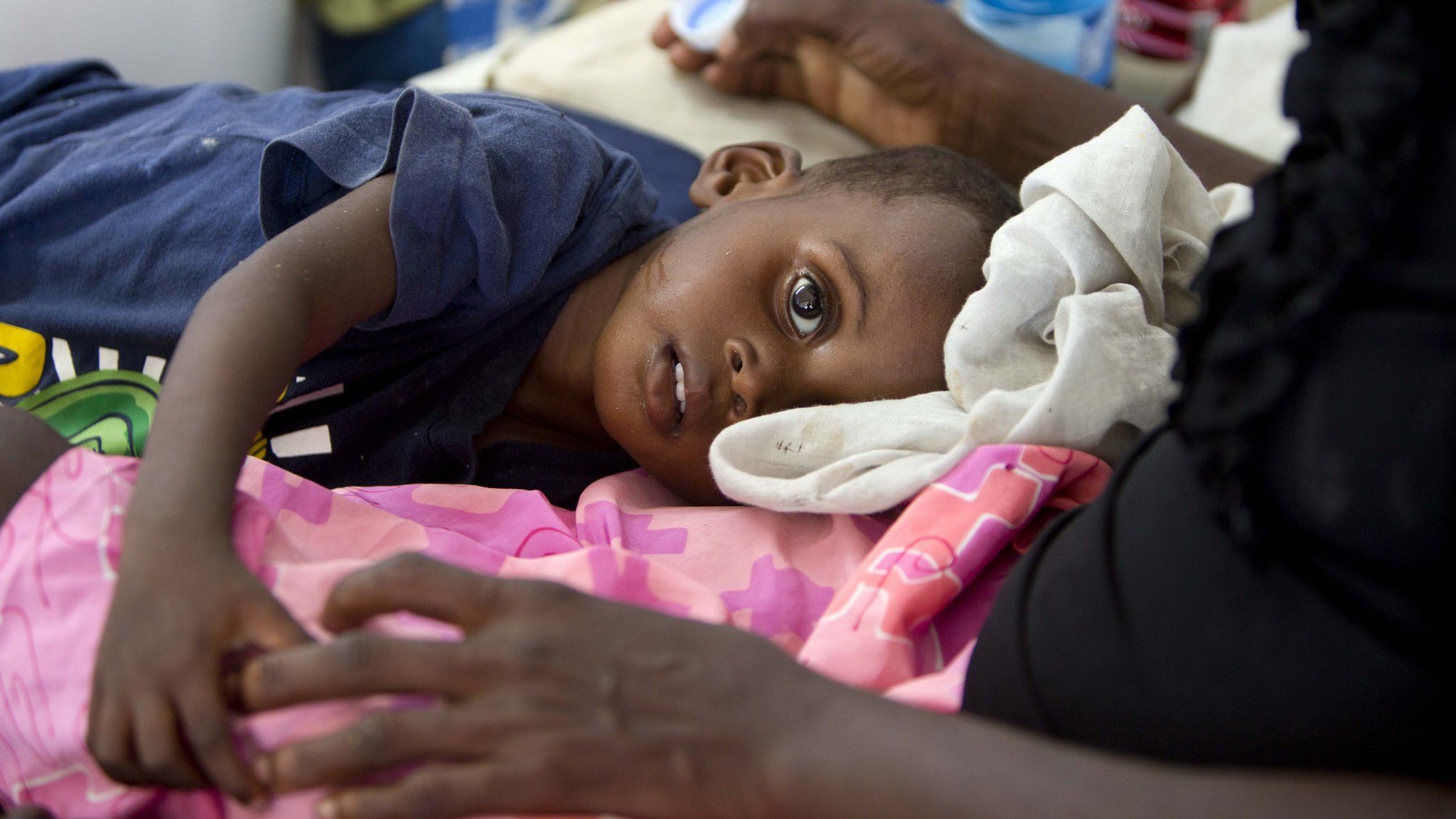 In this picture, a boy suffering from cholera receives treatment at a cholera centre in Anse D"Hainault, Haiti, on 11 October, 2016. The UN says Hurricane Matthew has increased the risk of a "renewed spike" in the cholera cases.