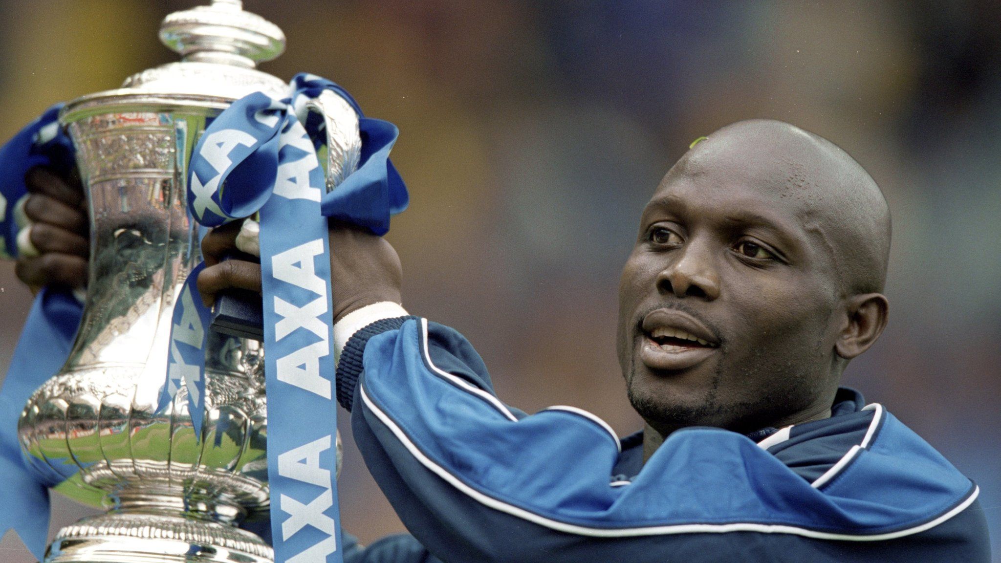 20 May 2000: George Weah of Chelsea lifts the FA Cup after the final against Aston Villa at Wembley Stadium in London.