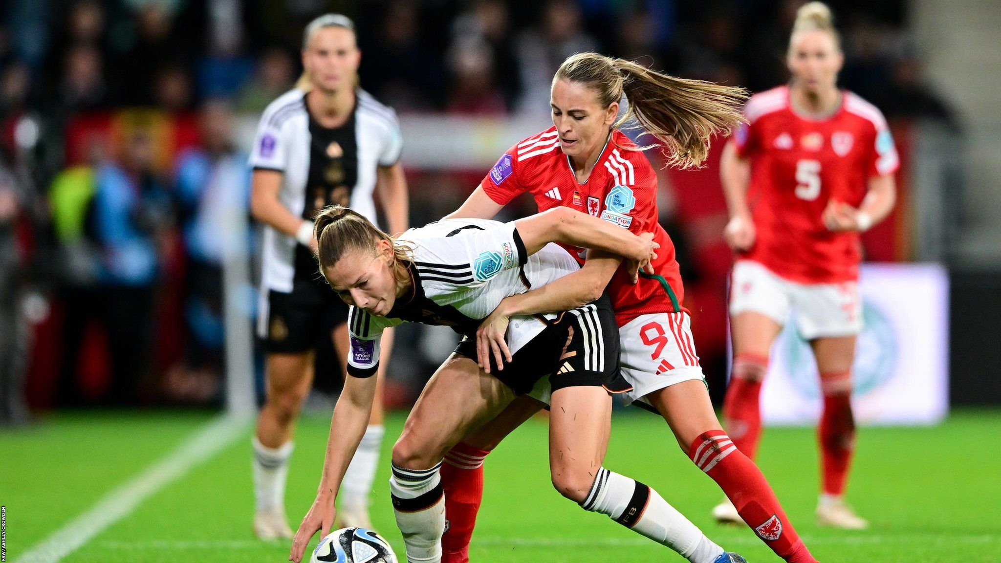 Germany’s Sarai Linder is fouled by Wales' Kayleigh Green