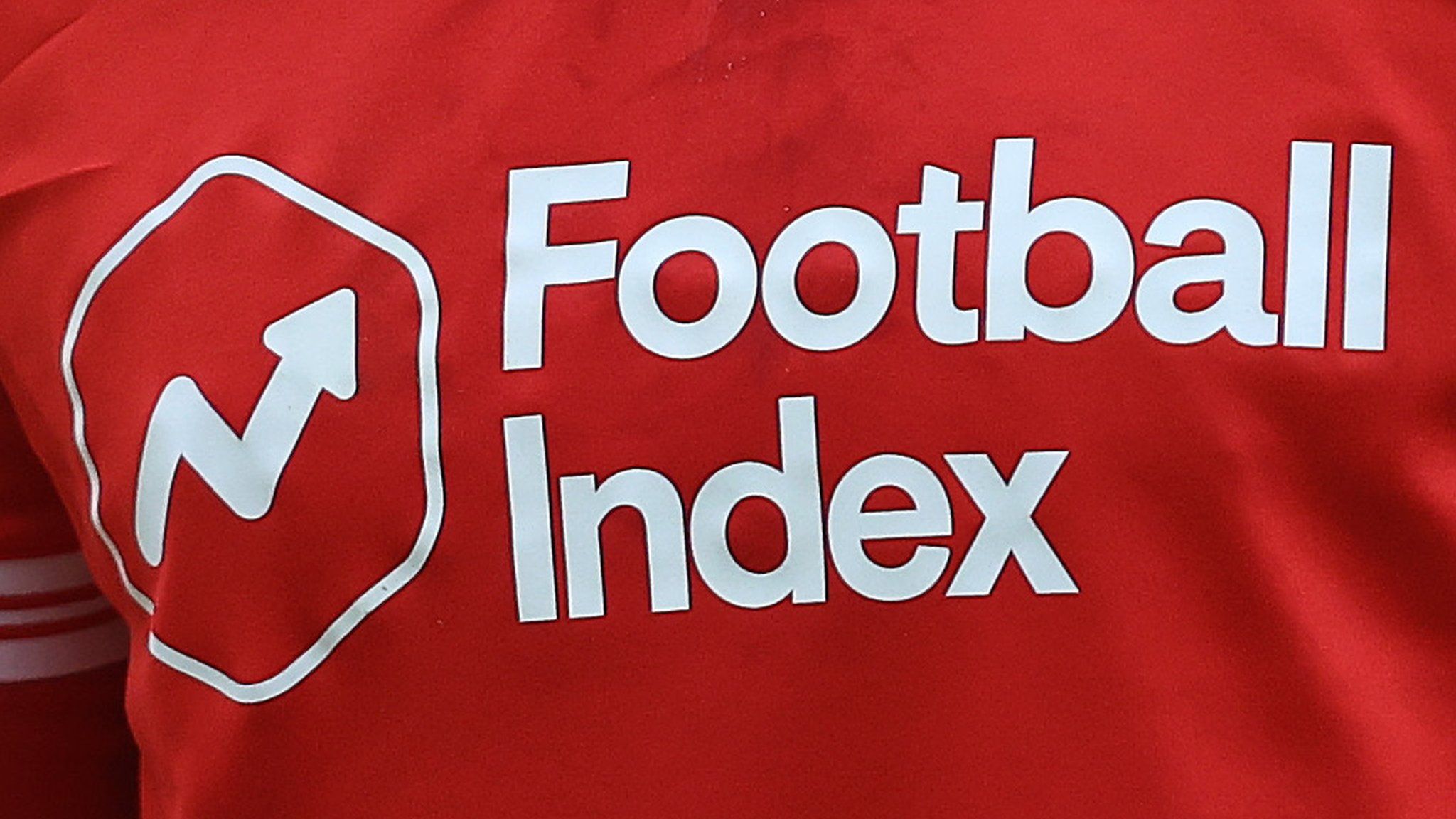 The Football Index logo and company name in white writing on the red Nottingham Forest 2020-21 home shirt