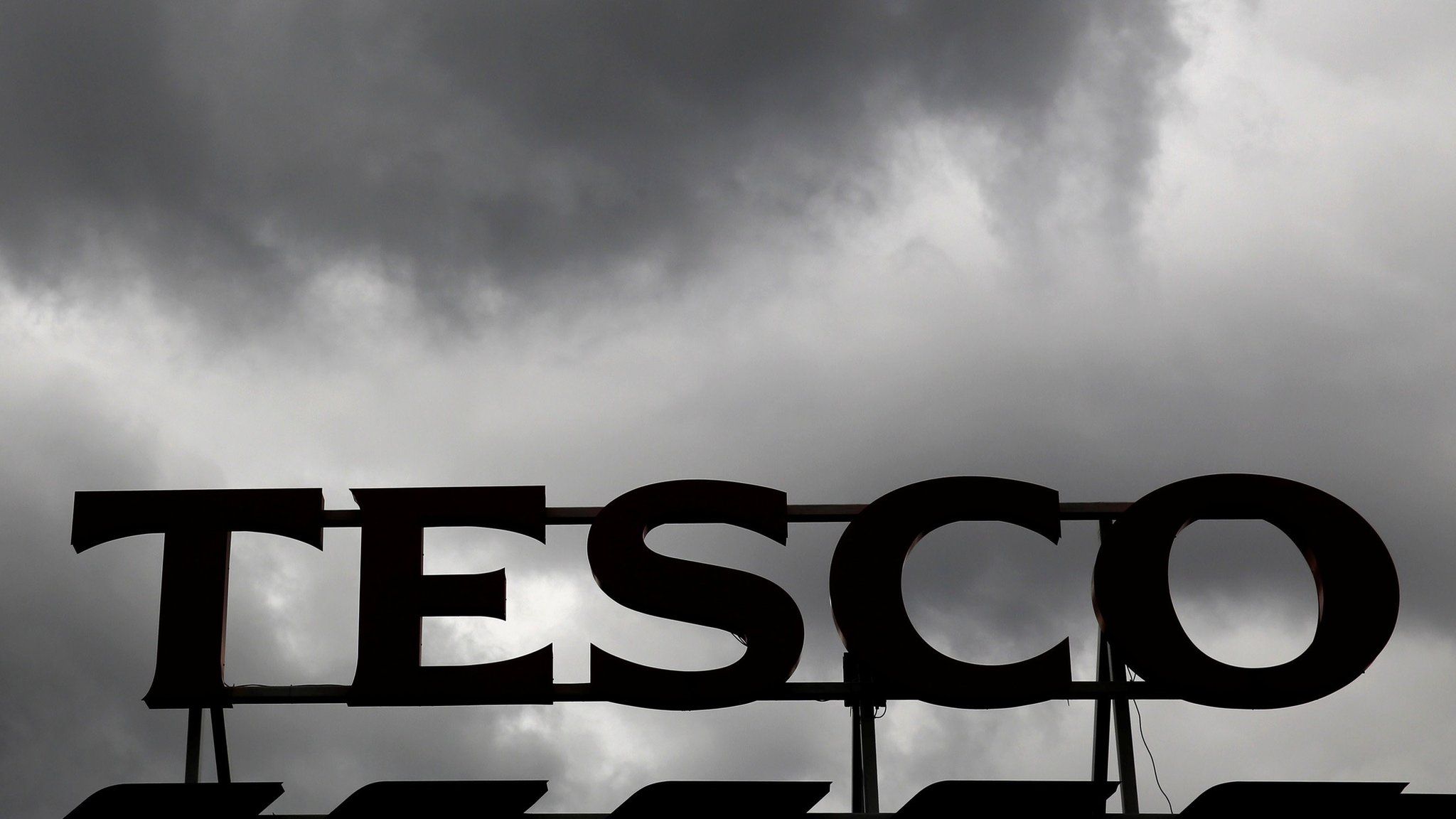 Grey clouds over a Tesco store