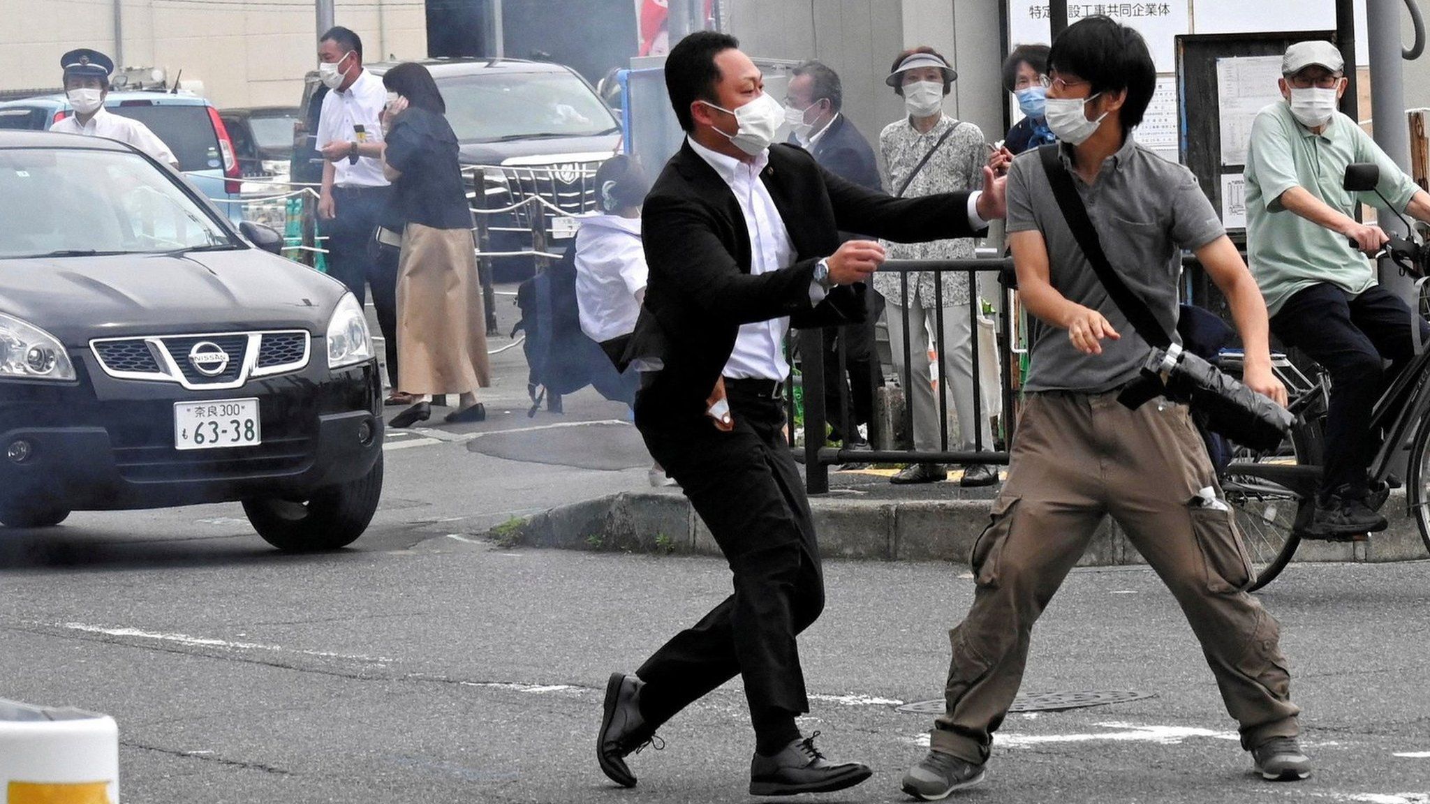 A police officer detains a man, believed to have shot former Japanese Prime Minister Shinzo Abe, in Nara, western Japan July 8, 2022