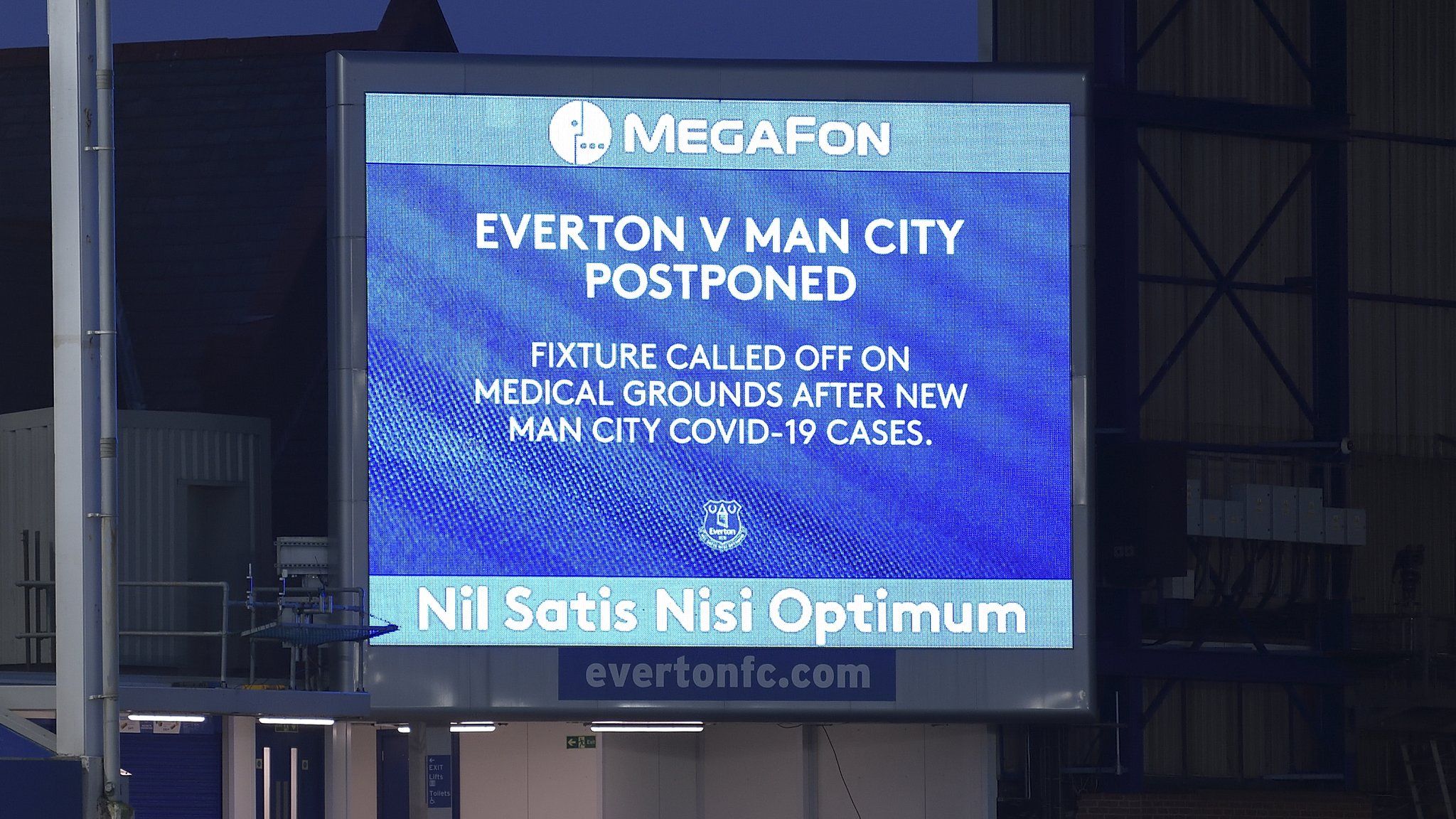 A sign saying Everton v Manchester City is postponed