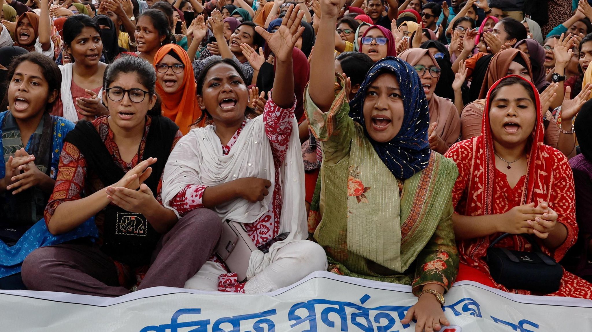 Students and job seekers shouts slogans as they protest to ban quotas for government job at Shahbagh Square in Dhaka, Bangladesh.