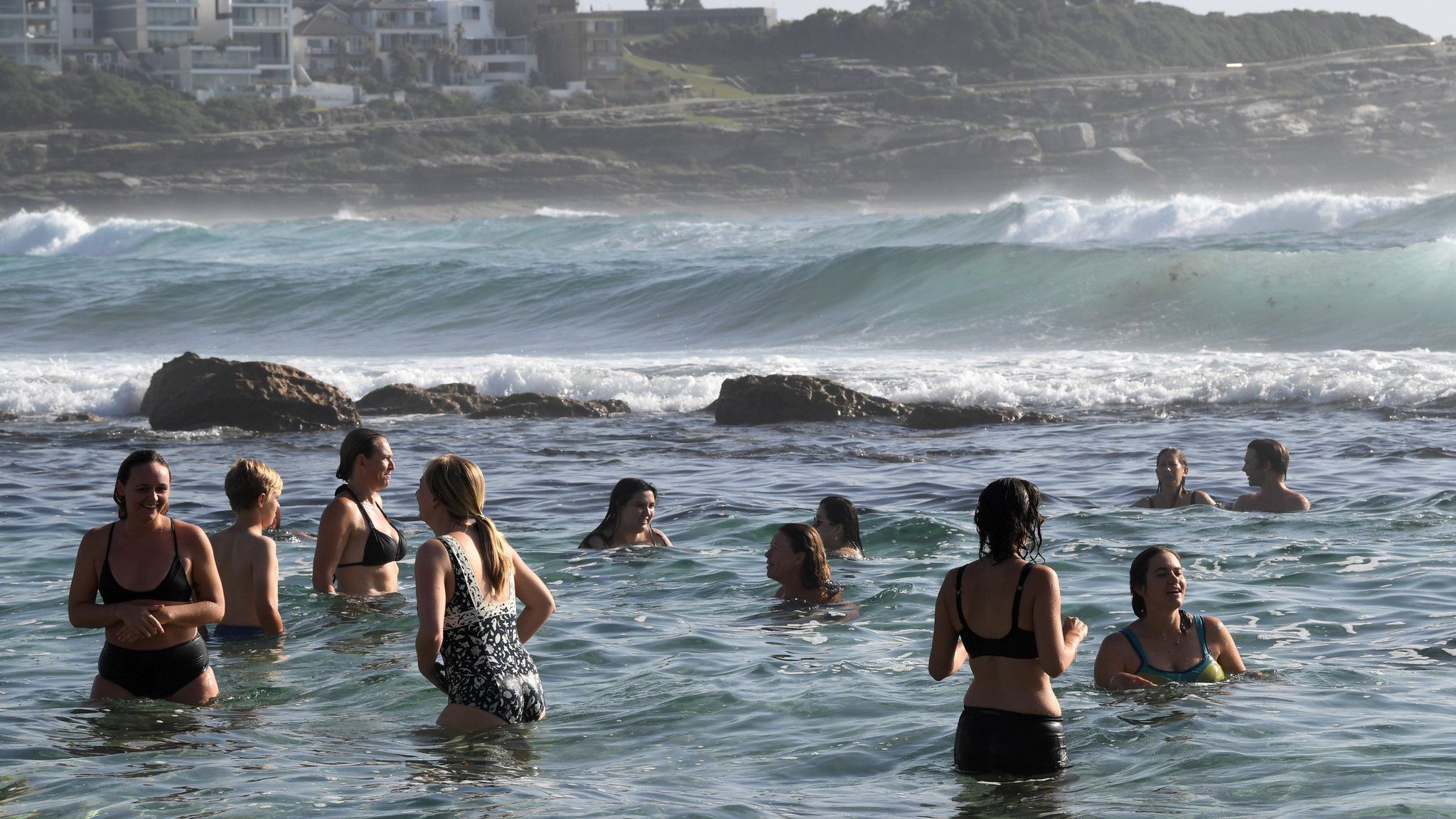 Beachgoers cool off at Bronte Beach in Sydney, New South Wales (NSW), Australia, 16 January 2019.