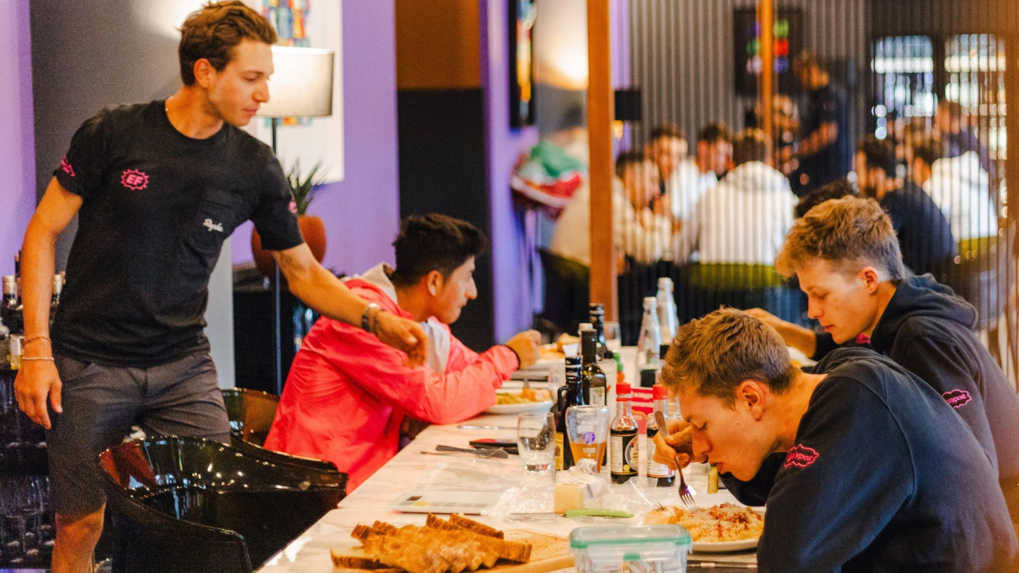 EF Education-EasyPost riders sit down to eat