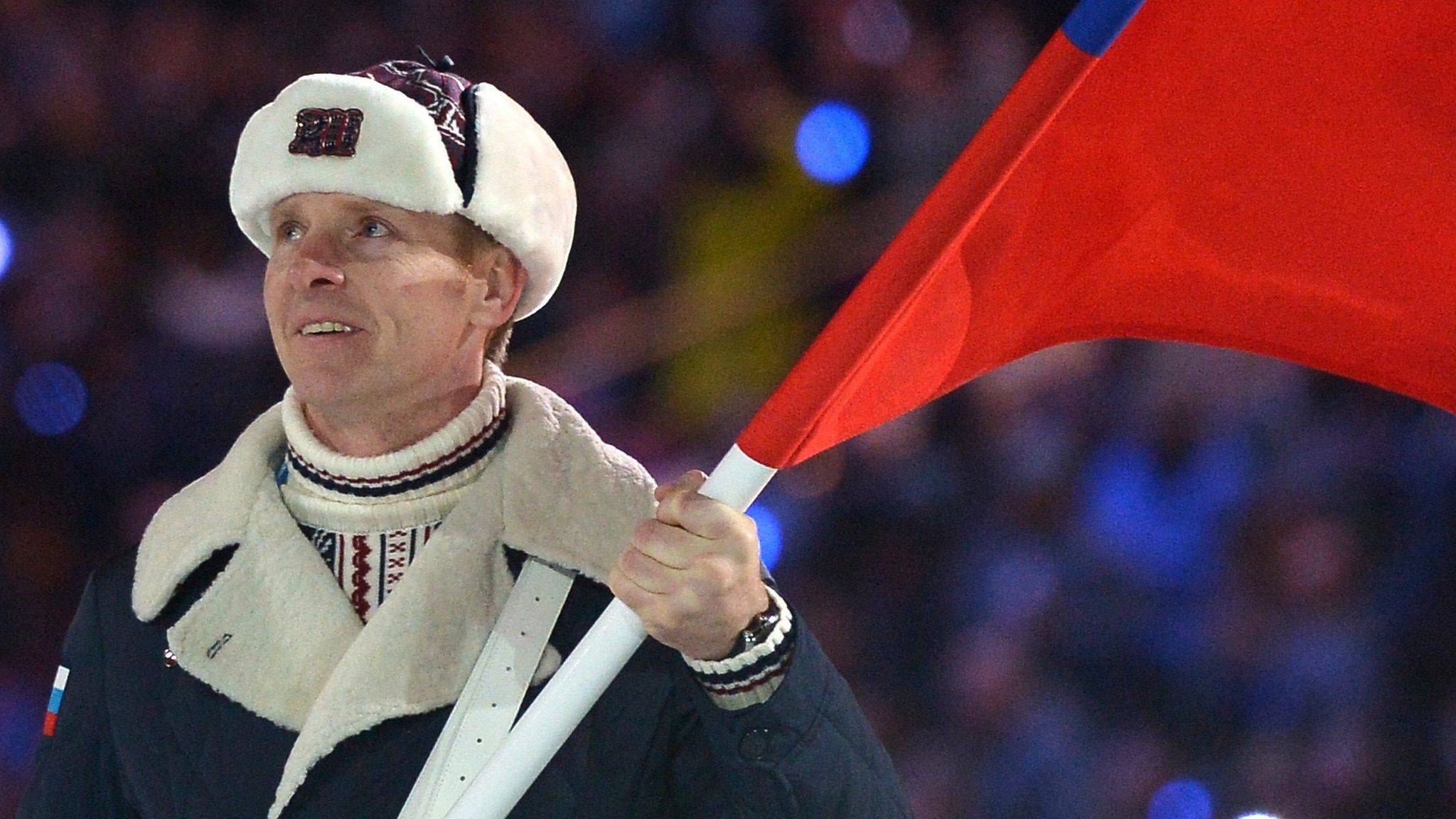 File photo taken in February 2014 shows Russia's flag bearer, bobsledder Alexander Zubkov, leading his national delegation during the Opening Ceremony of the Sochi Winter Olympics