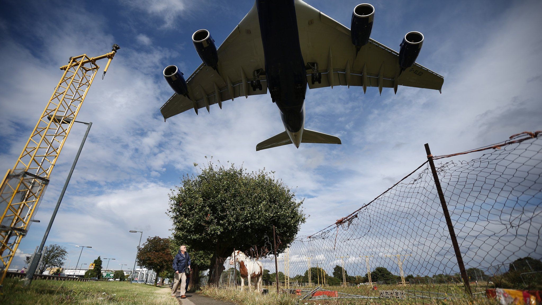 A passenger plane comes into land at Heathrow Airport, west London