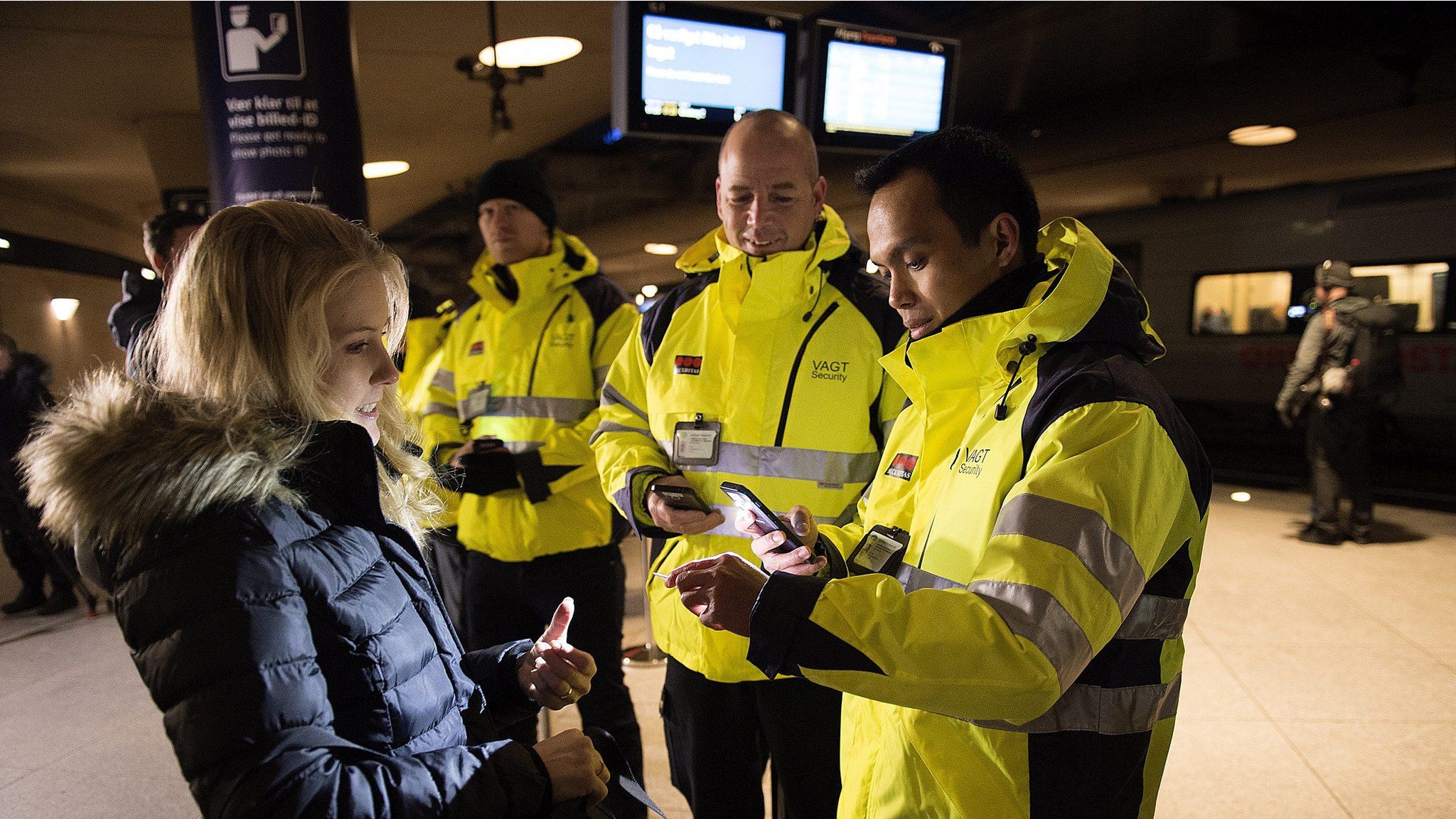 Security staff check IDs at Kastrup train station outside Copenhagen (4 Jan)