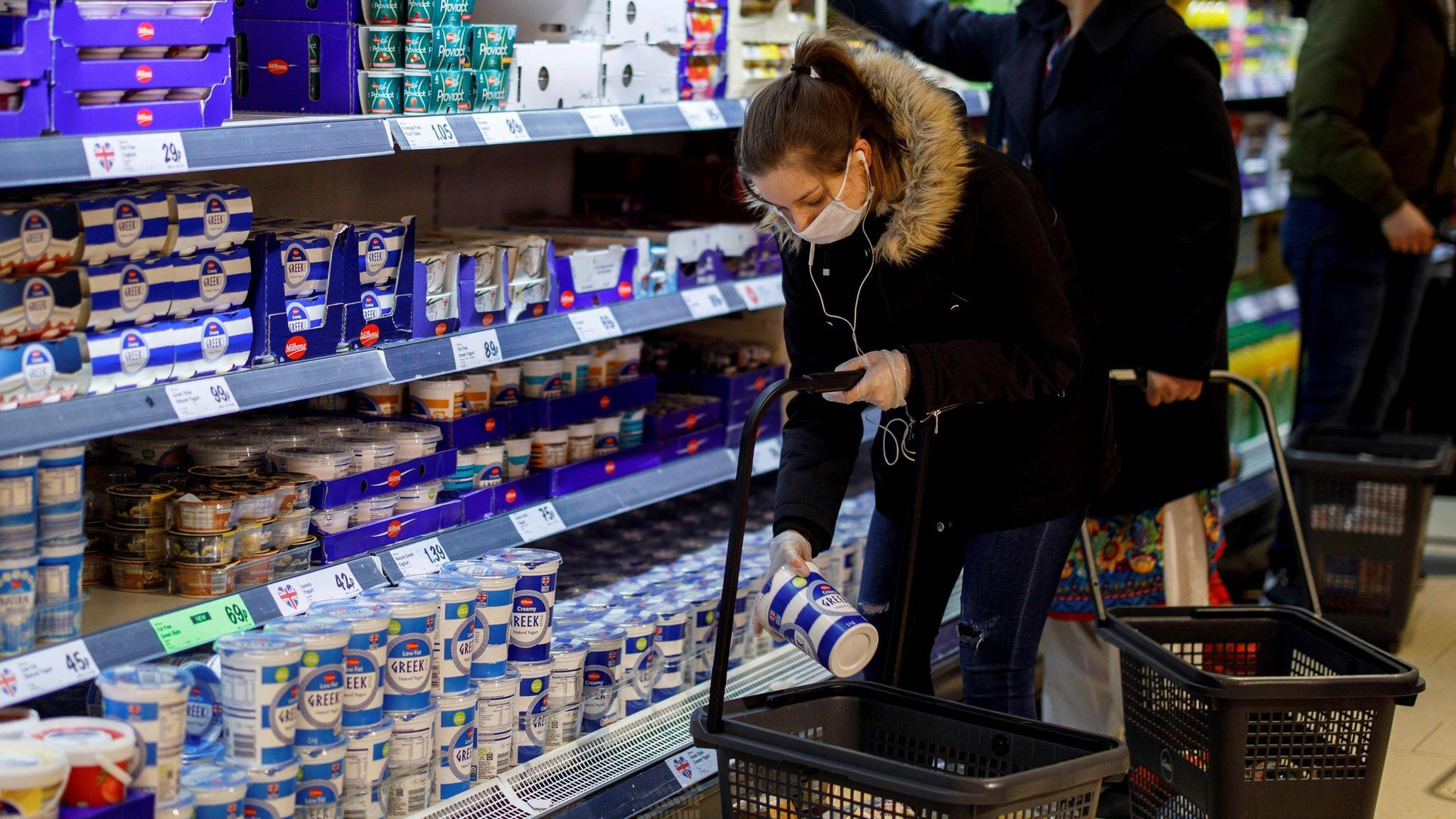 Woman shopping in London supermarket