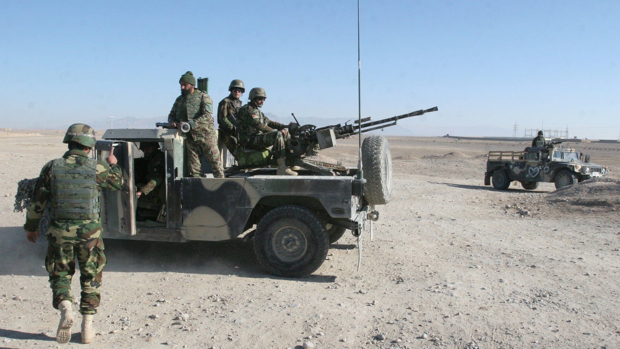 Afghan National Army soldiers guard at a checkpoint on the way to the Sangin district of Helmand province, Afghanistan, Wednesday, Dec. 23, 2015.