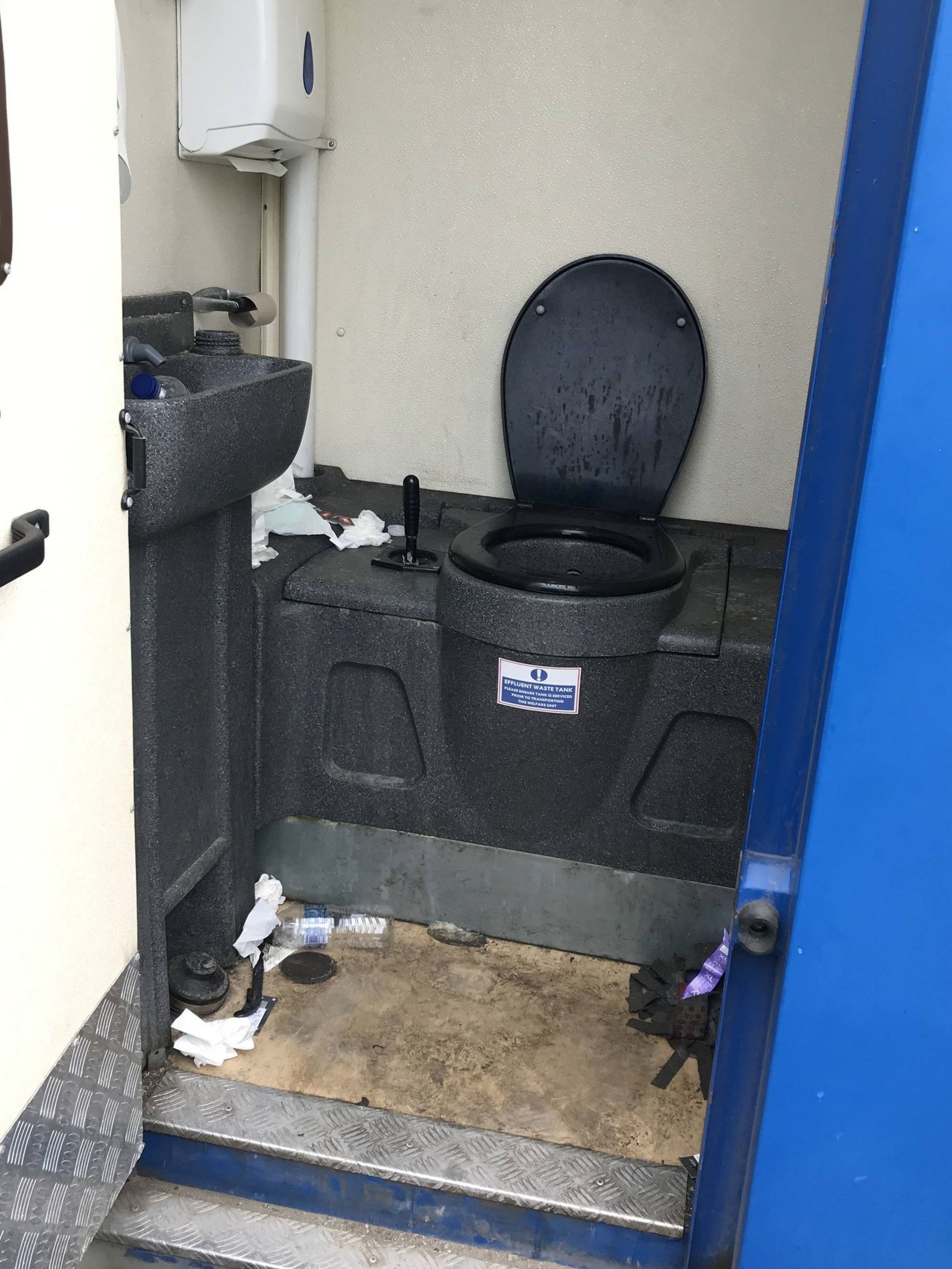 A dirty toilet at the Dover container