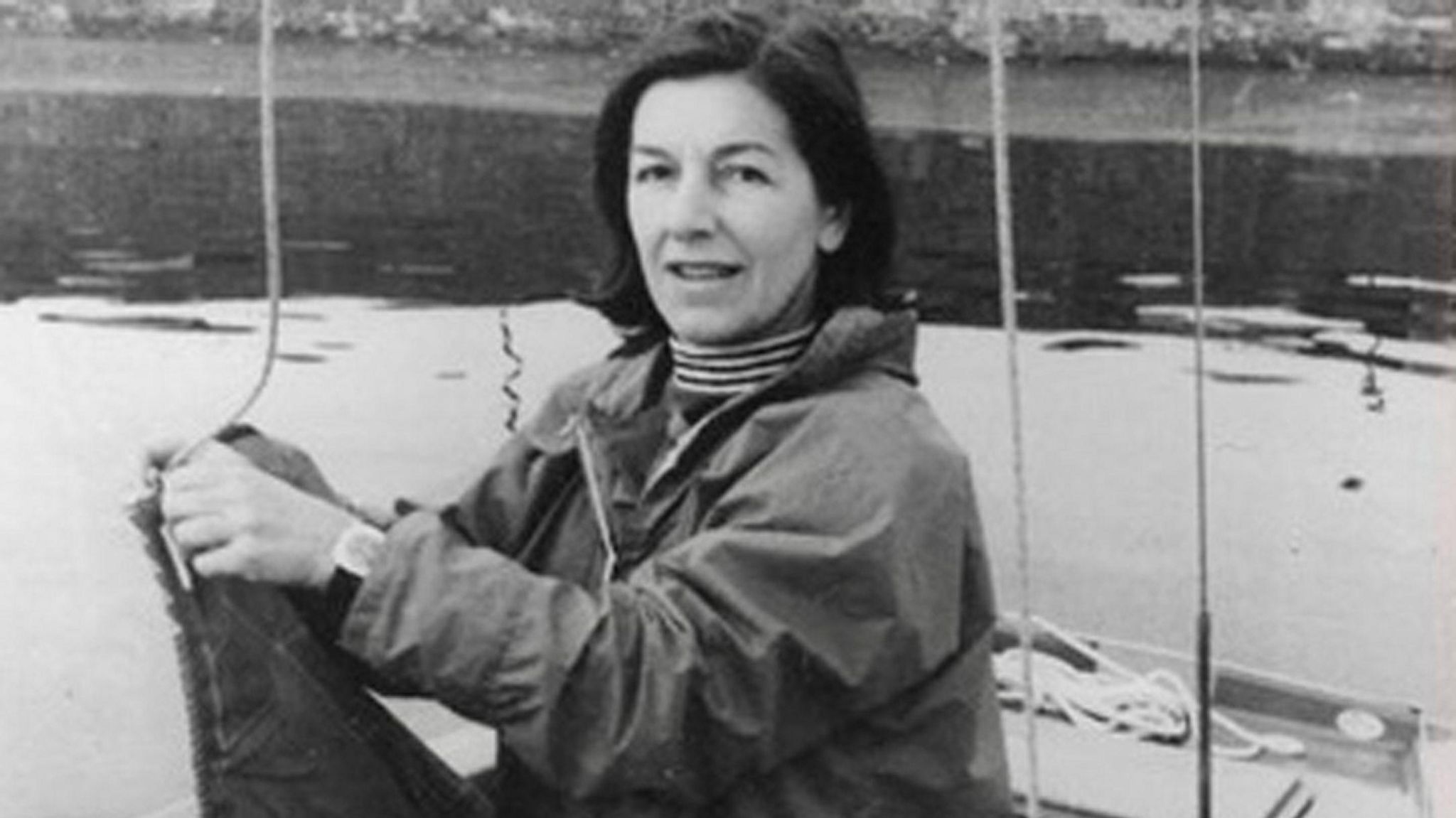 Black and white photo of Phyll Babb as a younger woman on a boat