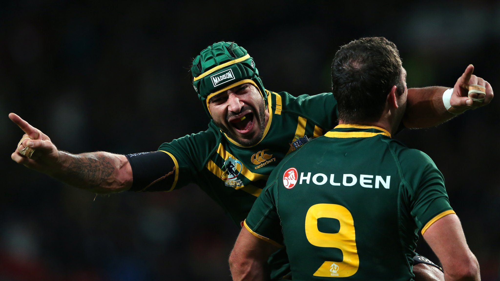 Johnathan Thurston and Cameron Smith of Australia celebrate after victory over New Zealand in the Rugby League World Cup Final between New Zealand and Australia at Old Trafford on November 30, 2013 in Manchester, England