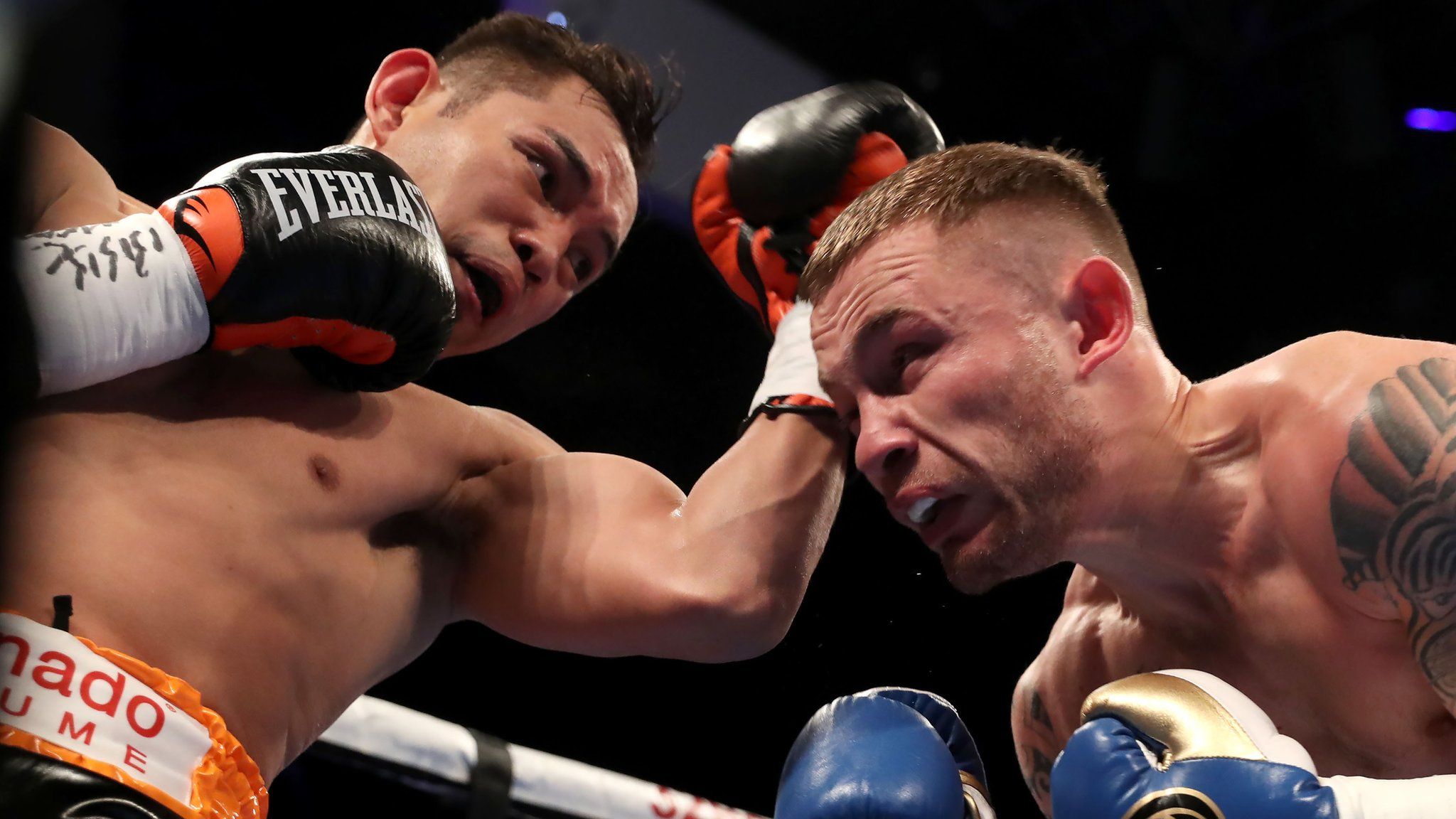 Carl Frampton evades a punch from Nonito Donaire in Belfast
