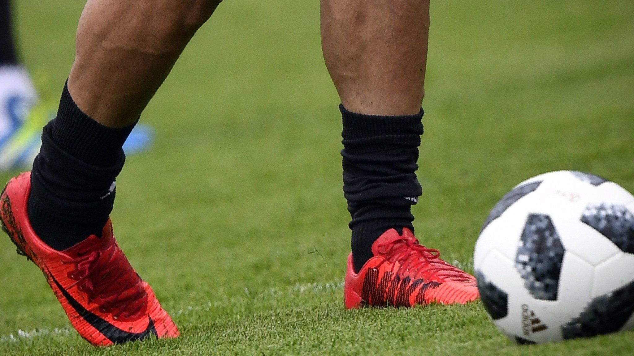 A picture taken on June 12, 2018 shows Nike football shoes of Iran's forward Mehdi Taremi during a training session in Bakovka, outside Moscow, ahead of the Russia 2018 World Cup football tournament.