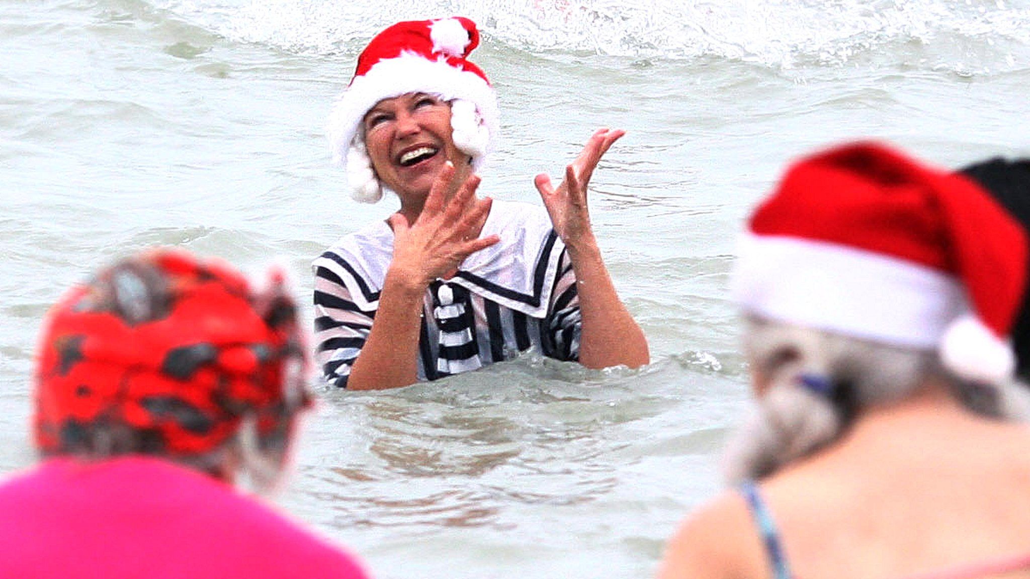 Swimmers taking part in a Christmas Day swim in Bournemouth
