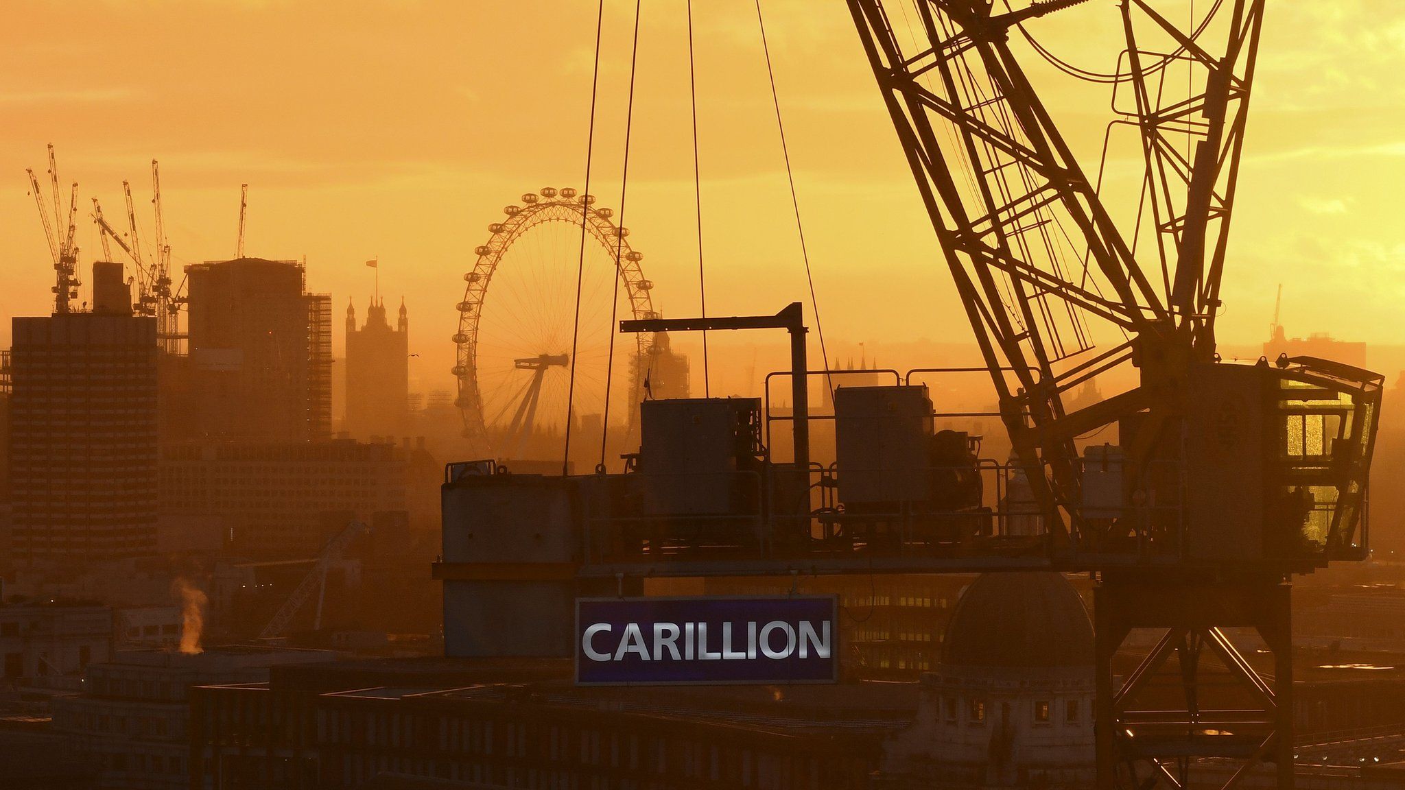Skyline with construction workers and Carillion sign