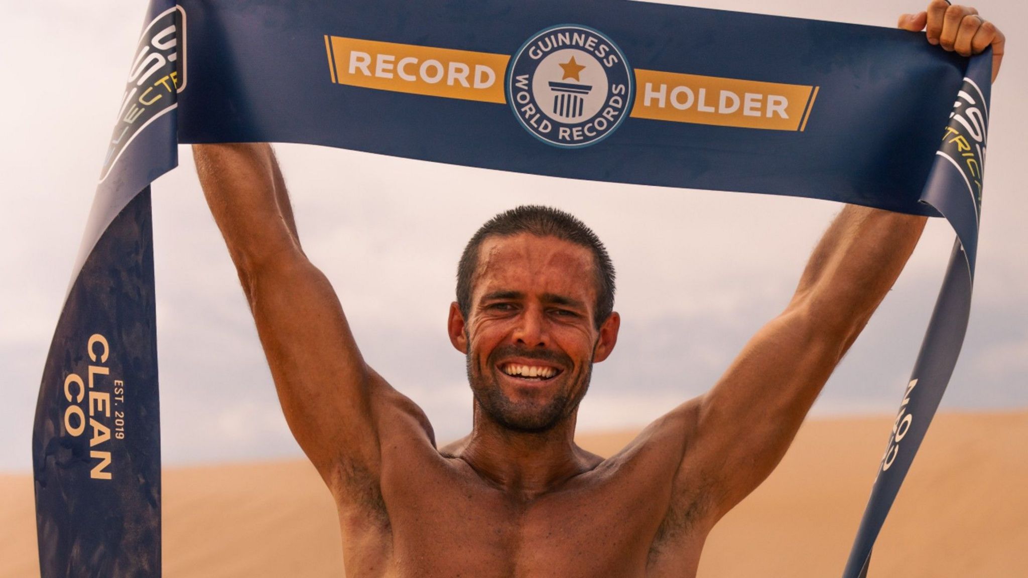 Spencer Matthews holding a Guinness World Records banner