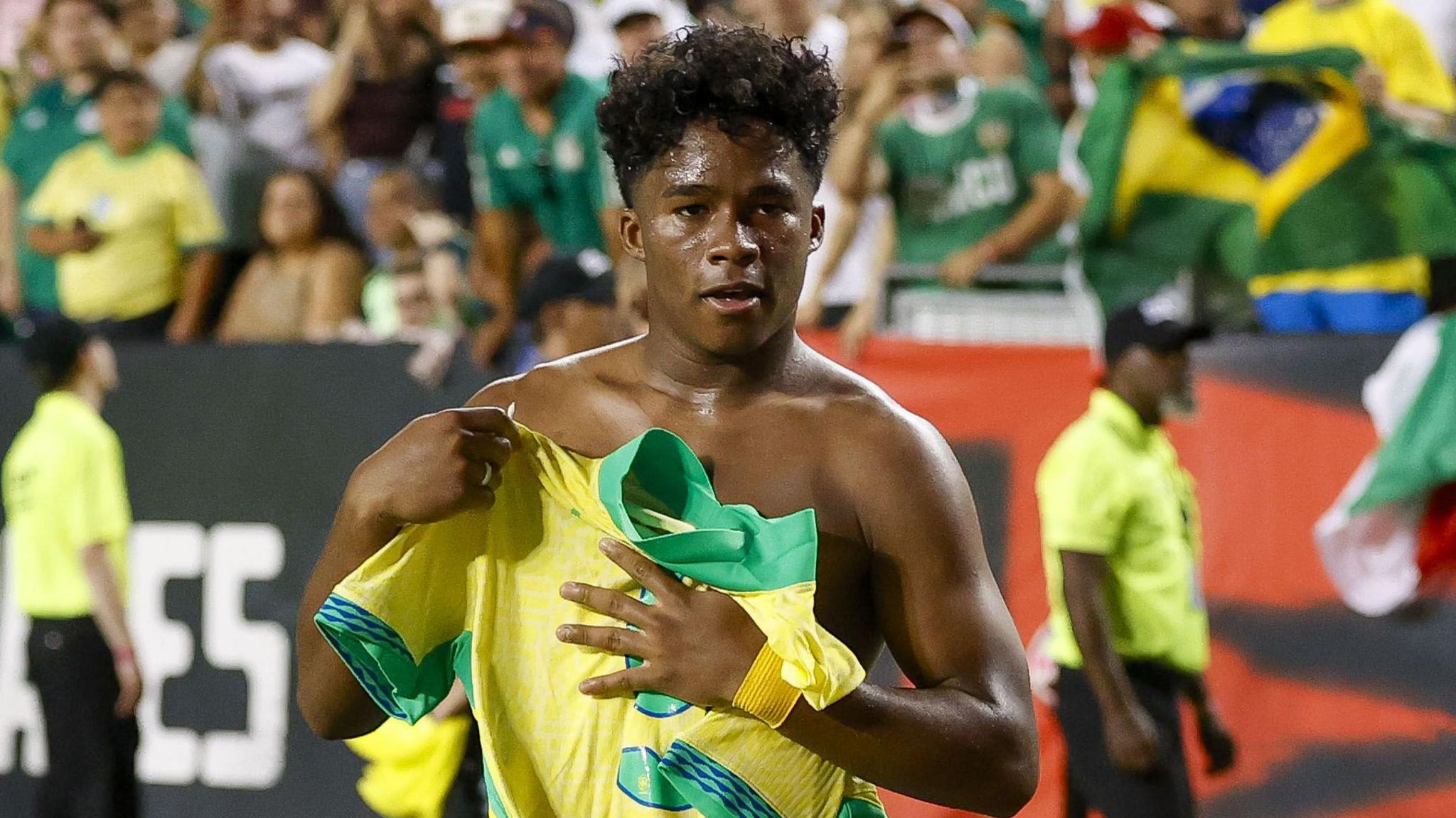 Endrick holds his shirt to his chest after removing it while celebrating a goal for Brazil against Mexico