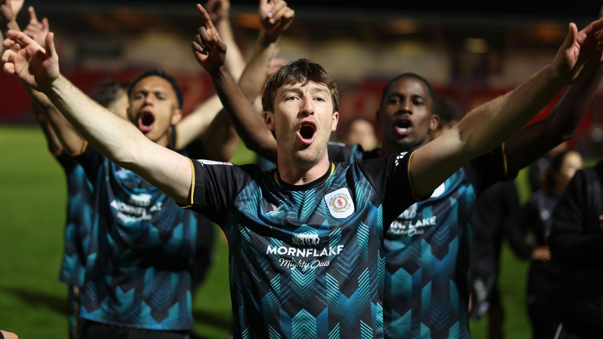 Chris Long celebrates Crewe reaching the League Two play-off final