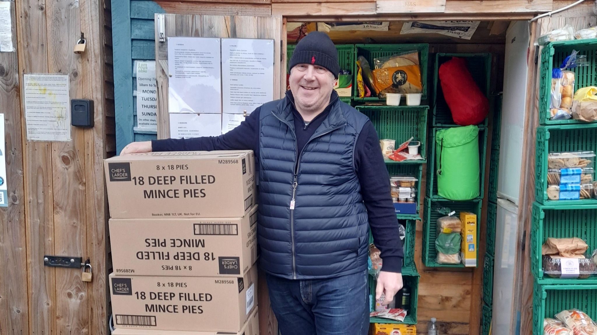 John McGall with boxes of mince pies