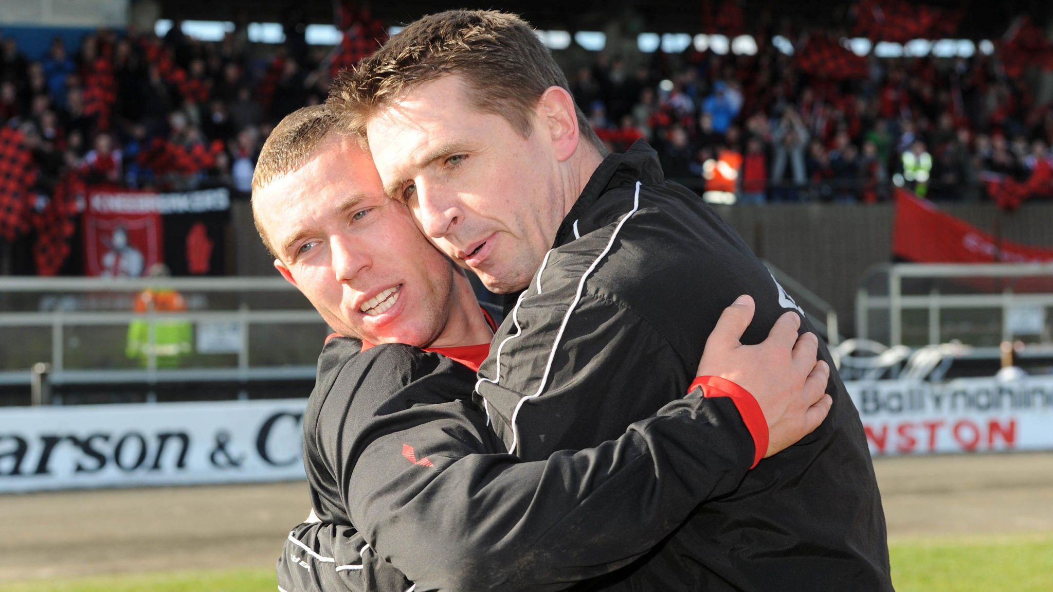 Mark Dickson and Stephen Baxter embrace at full-time