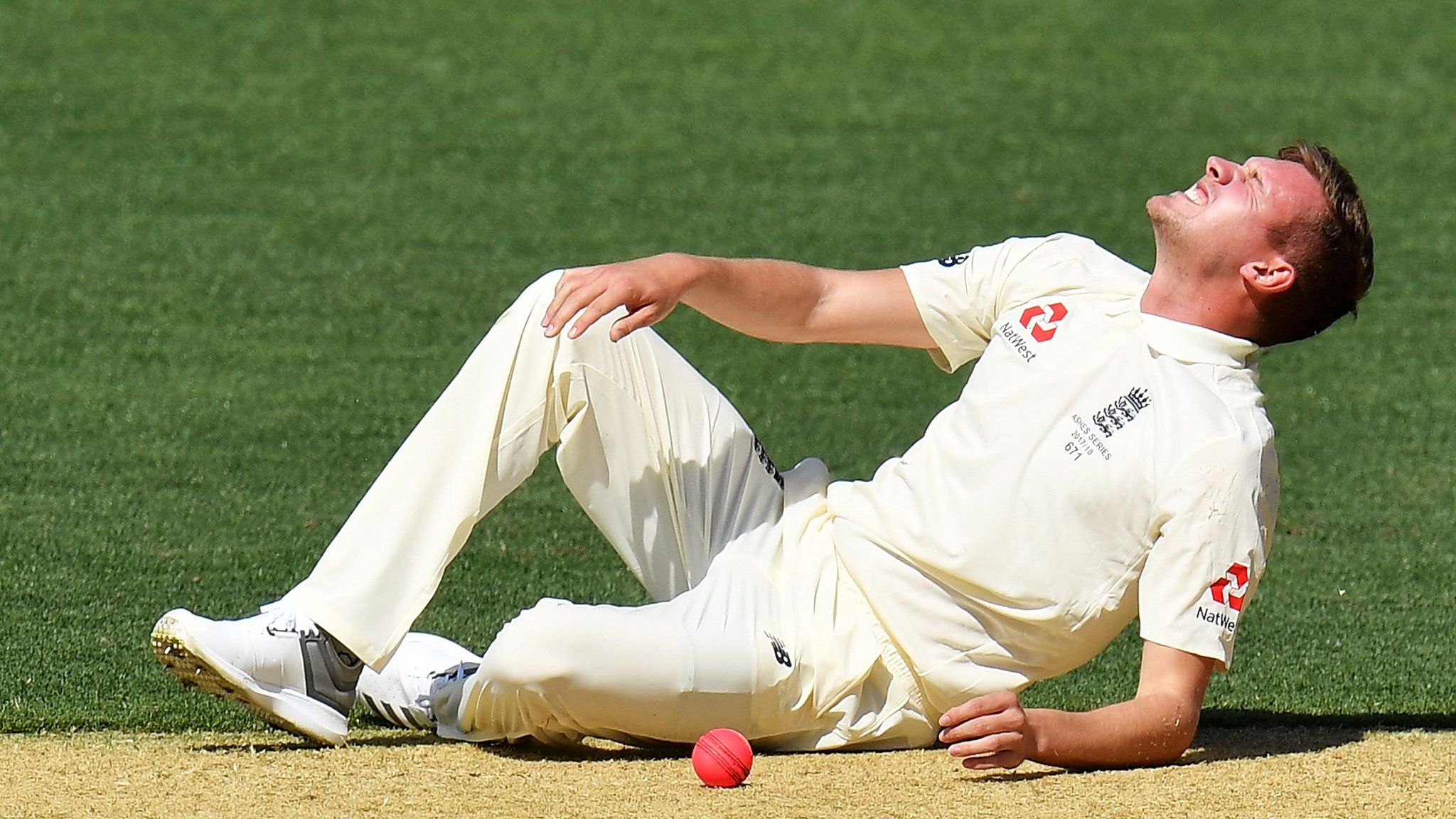 England's Jake Ball lies on the ground after spraining an ankle