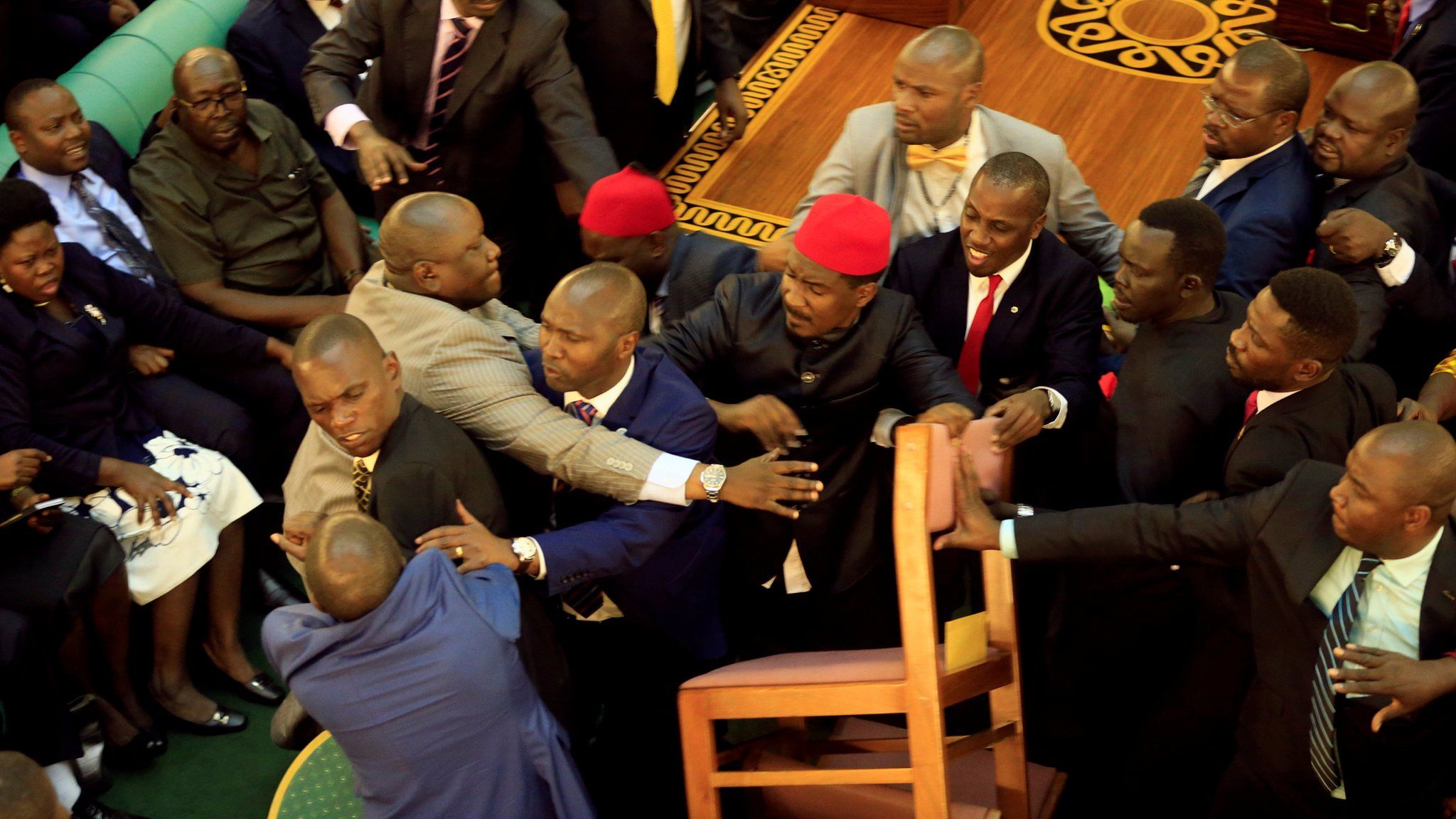 Ugandan MPs involved in a fight in parliament ahead of proposed age limit amendment bill debate, in Kampala, September 26, 2017