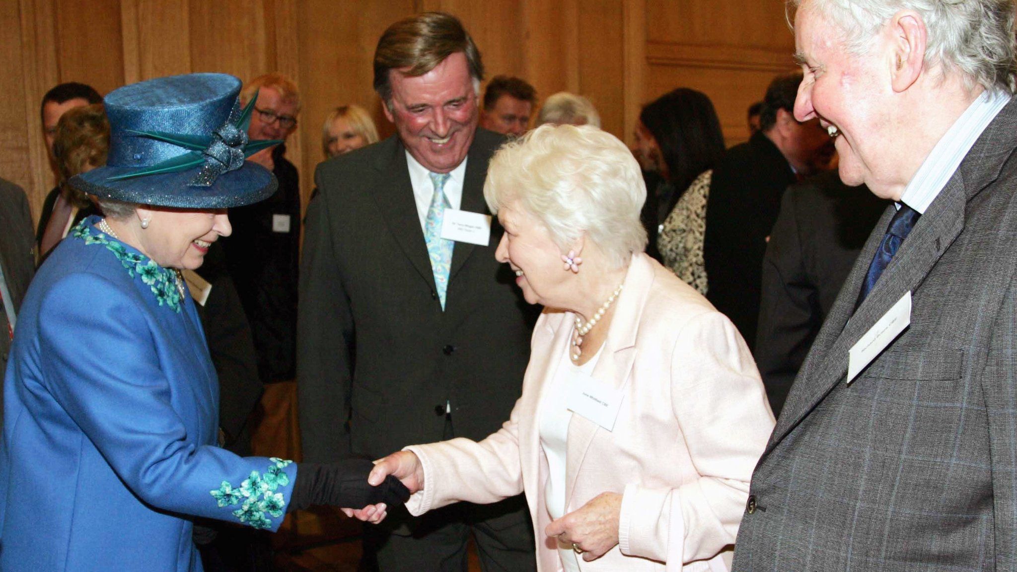 June Whitfield shakes hands with the Queen