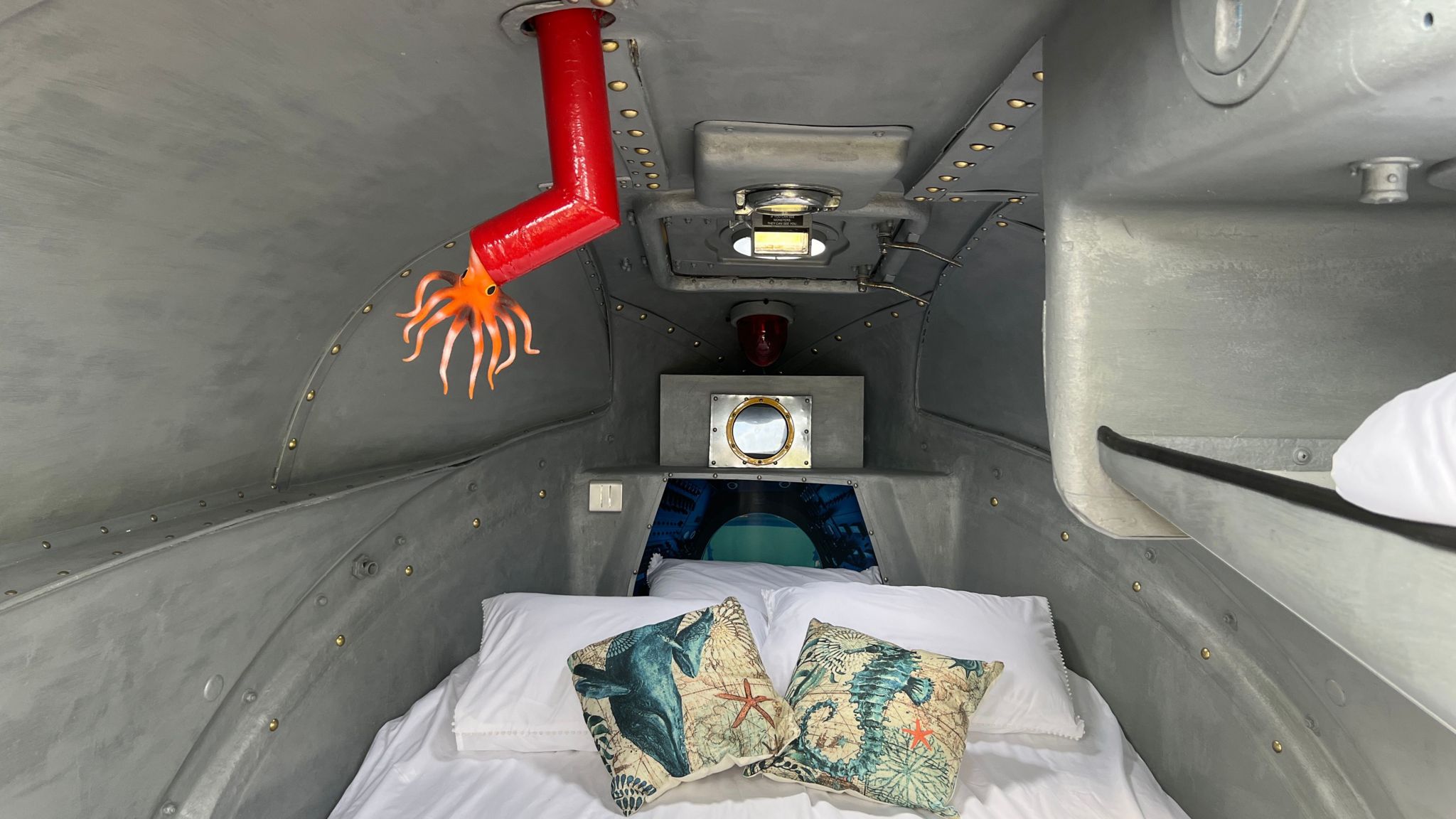 A bed inside the glamping submarine at Cheddar